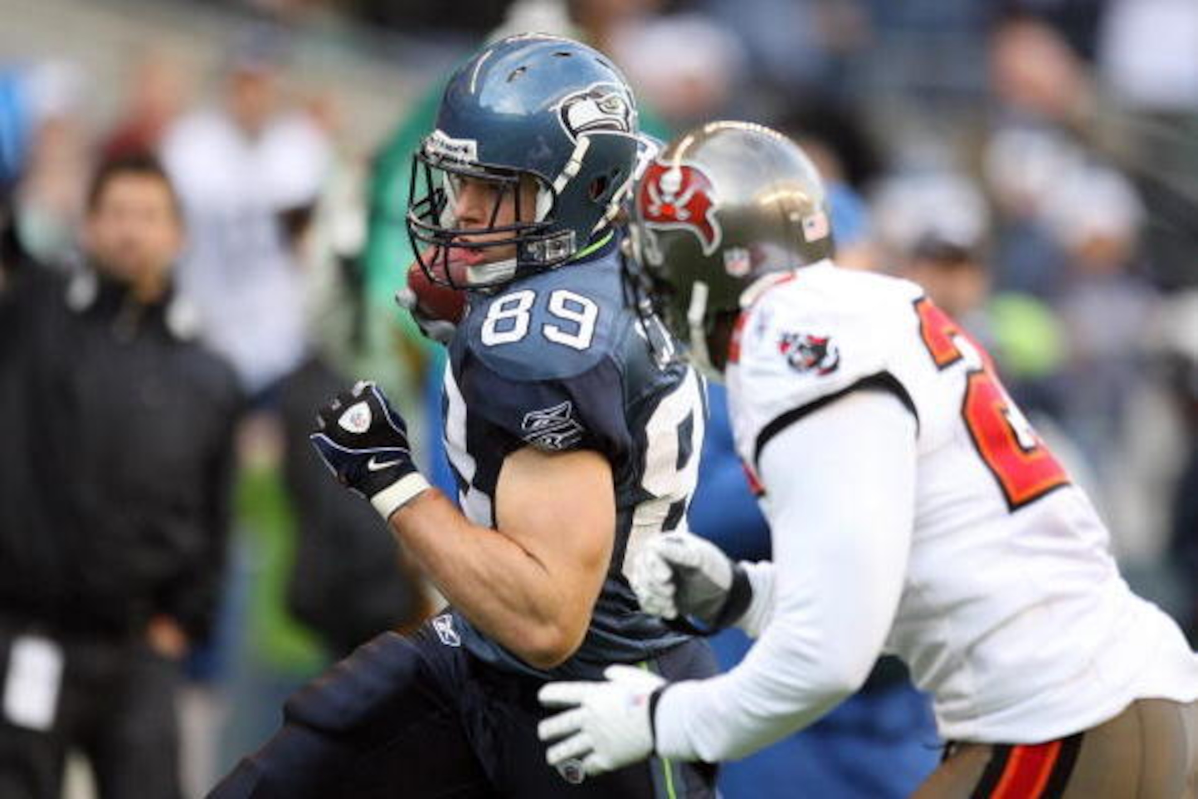SEATTLE - DECEMBER 20:  John Carlson #89 of the Seattle Seahawks runs with the ball for yardage during their game against the Tampa Bay Buccaneers on December 20, 2009 at Qwest Field in Seattle, Washington. The Buccaneers defeated the Seahawks 24-7. (Phot