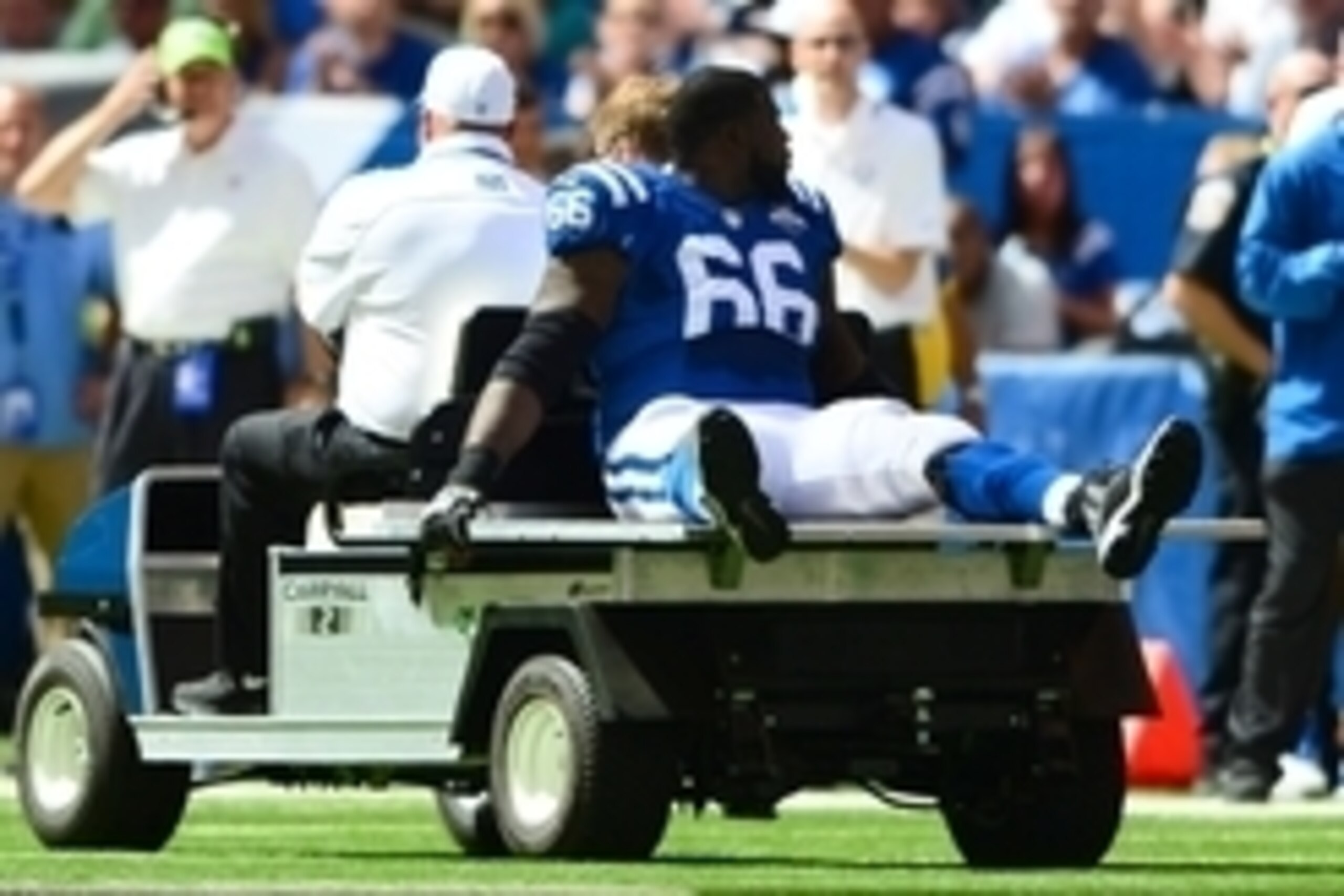 Sep 15, 2013; Indianapolis, IN, USA; Indianapolis Colts guard Donald Thomas (66) is carried off the field after being injured during the first quarter against the Miami Dolphins at Lucas Oil Stadium. Mandatory Credit: Andrew Weber-USA TODAY Sports