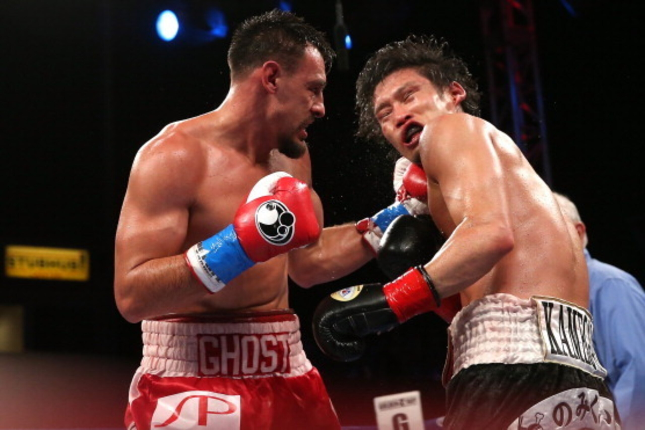 LOS ANGELES, CA - JUNE 21:  Robert Guerrero (R) lands a punch on Yoshihiro Kamegai in their welterweight bout at StubHub Center on June 21, 2014 in Los Angeles, California.  Guerrero won by unanimous decision.  (Photo by Stephen Dunn/Getty Images)