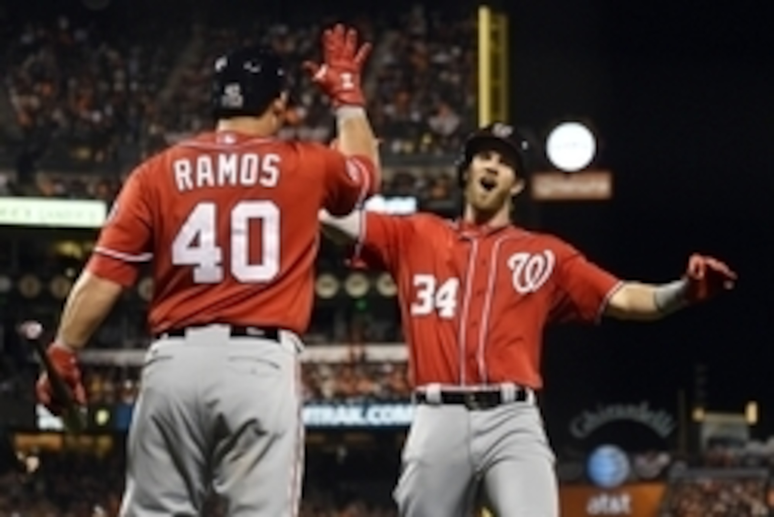 Oct 7, 2014; San Francisco, CA, USA; Washington Nationals left fielder Bryce Harper (34) celebrates with catcher Wilson Ramos (40) after hitting a solo home run against the San Francisco Giants in the 7th inning during game four of the 2014 NLDS baseball