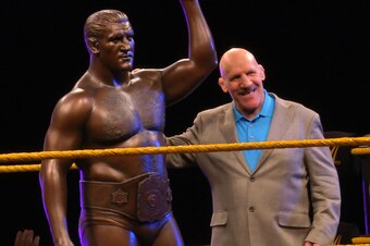 Bruno Sammartino stands with a statue of himself.