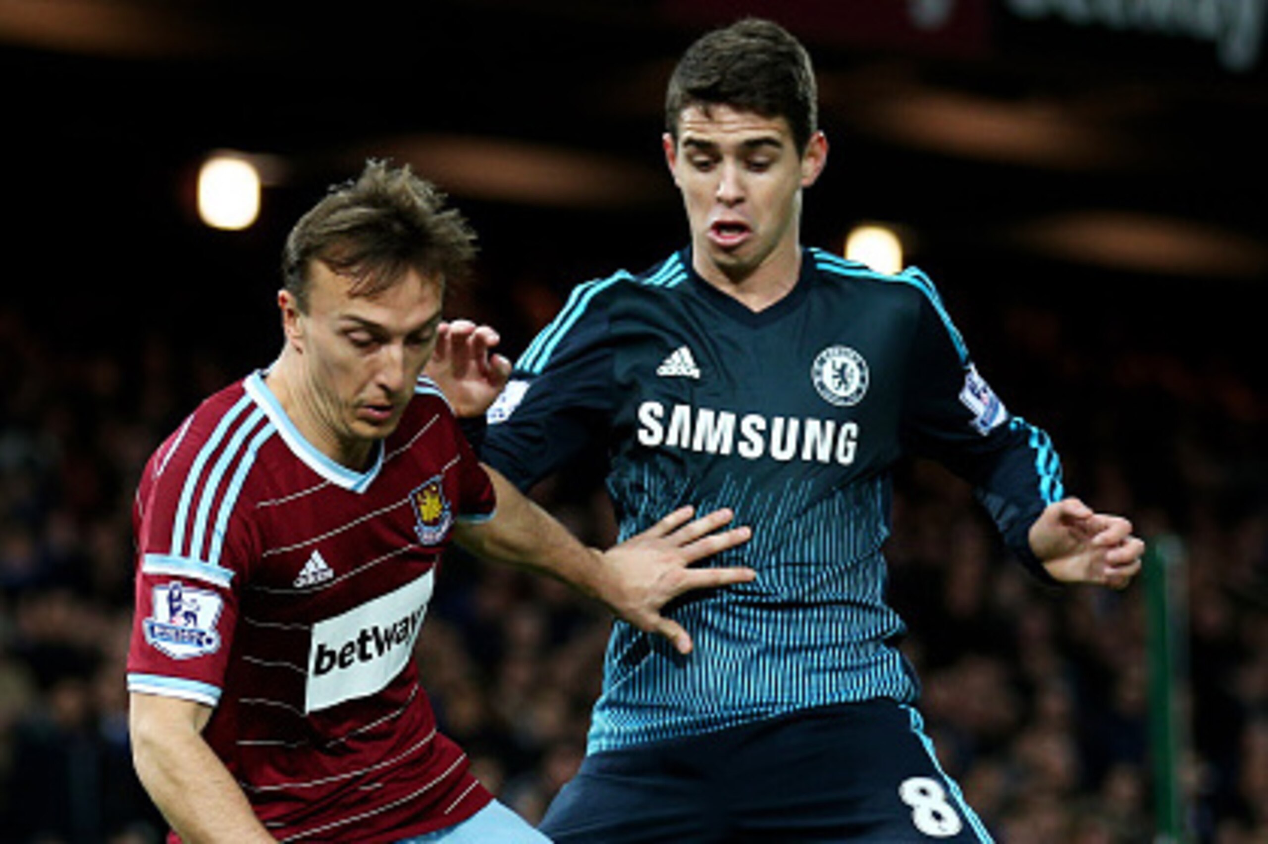 LONDON, ENGLAND - MARCH 04:  Mark Noble of West Ham is challenged by Oscar of Chelsea during the Barclays Premier League match between West Ham and Chelsea at the Boleyn Ground on March 4, 2015 in London, England.  (Photo by Paul Gilham/Getty Images)