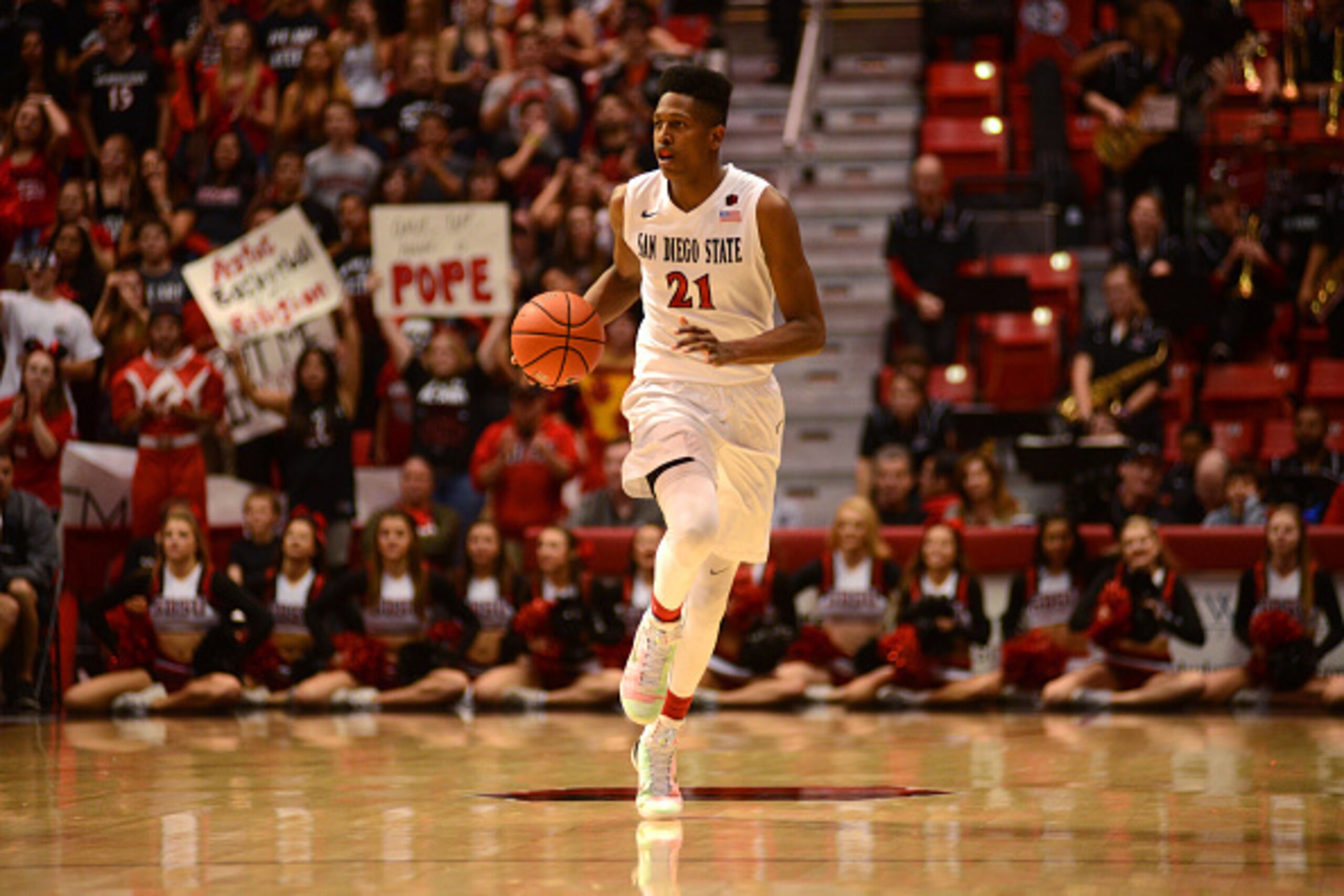 SAN DIEGO, CA - JANUARY 31:  Malik Pope #21 of the San Diego State Aztecs dribbles the ball in the second half of the game against the Utah State Aggies at Viejas Arena on January 31, 2015 in San Diego, California. (Photo by Kent C. Horner/Getty Images)