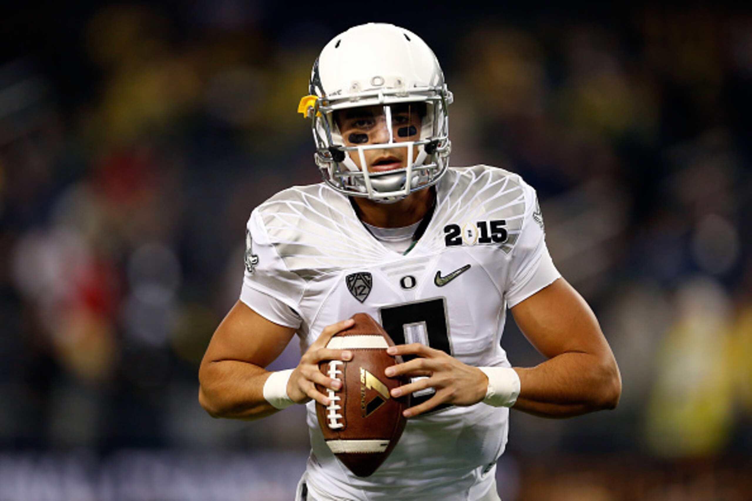 ARLINGTON, TX - JANUARY 12:  Quarterback Marcus Mariota #8 of the Oregon Ducks warms up prior to the College Football Playoff National Championship Game against the Ohio State Buckeyes at AT&T Stadium on January 12, 2015 in Arlington, Texas.  (Photo by Ch