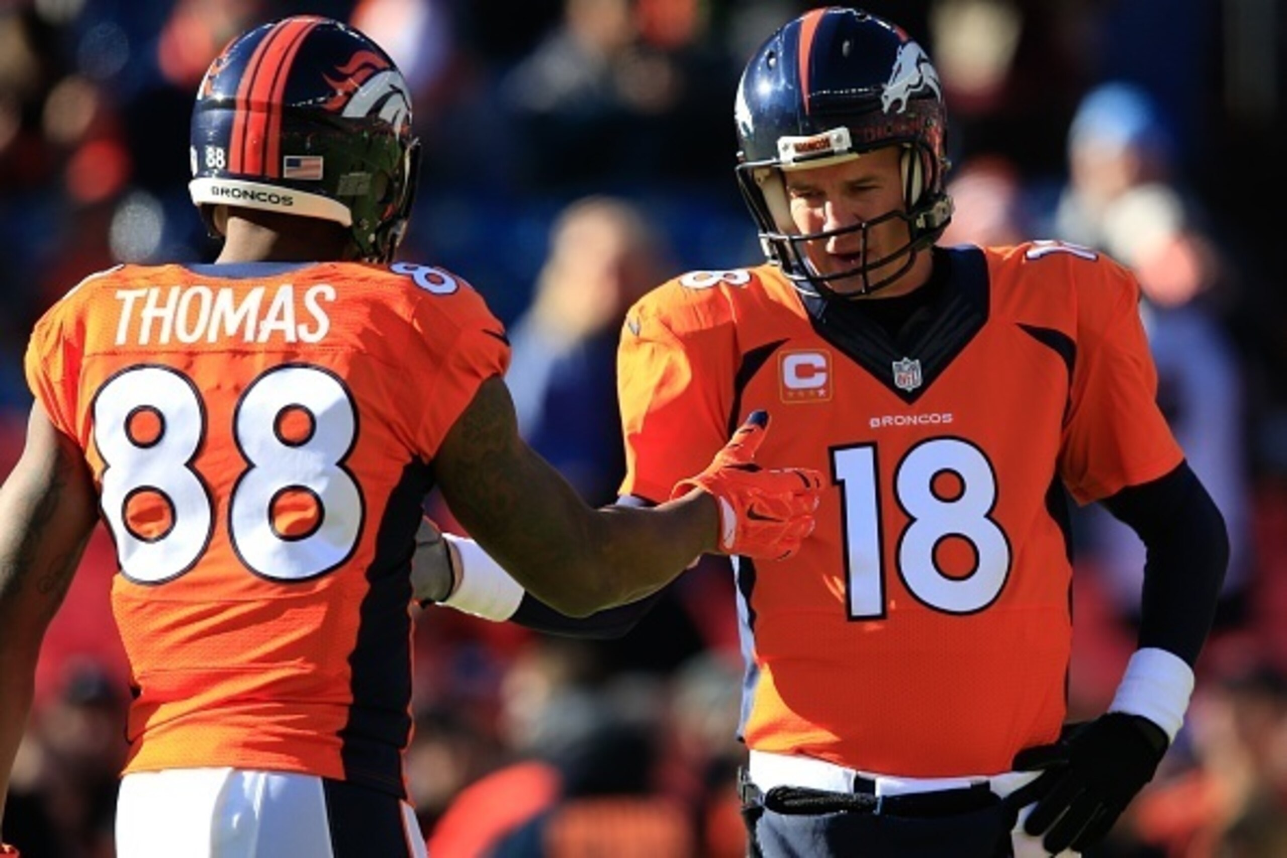 DENVER, CO - DECEMBER 28:  Quarterback Peyton Manning #18 and wide receiver Demaryius Thomas #88 of the Denver Broncos warm up before a game against the Oakland Raiders at Sports Authority Field at Mile High on December 28, 2014 in Denver, Colorado.  (Pho
