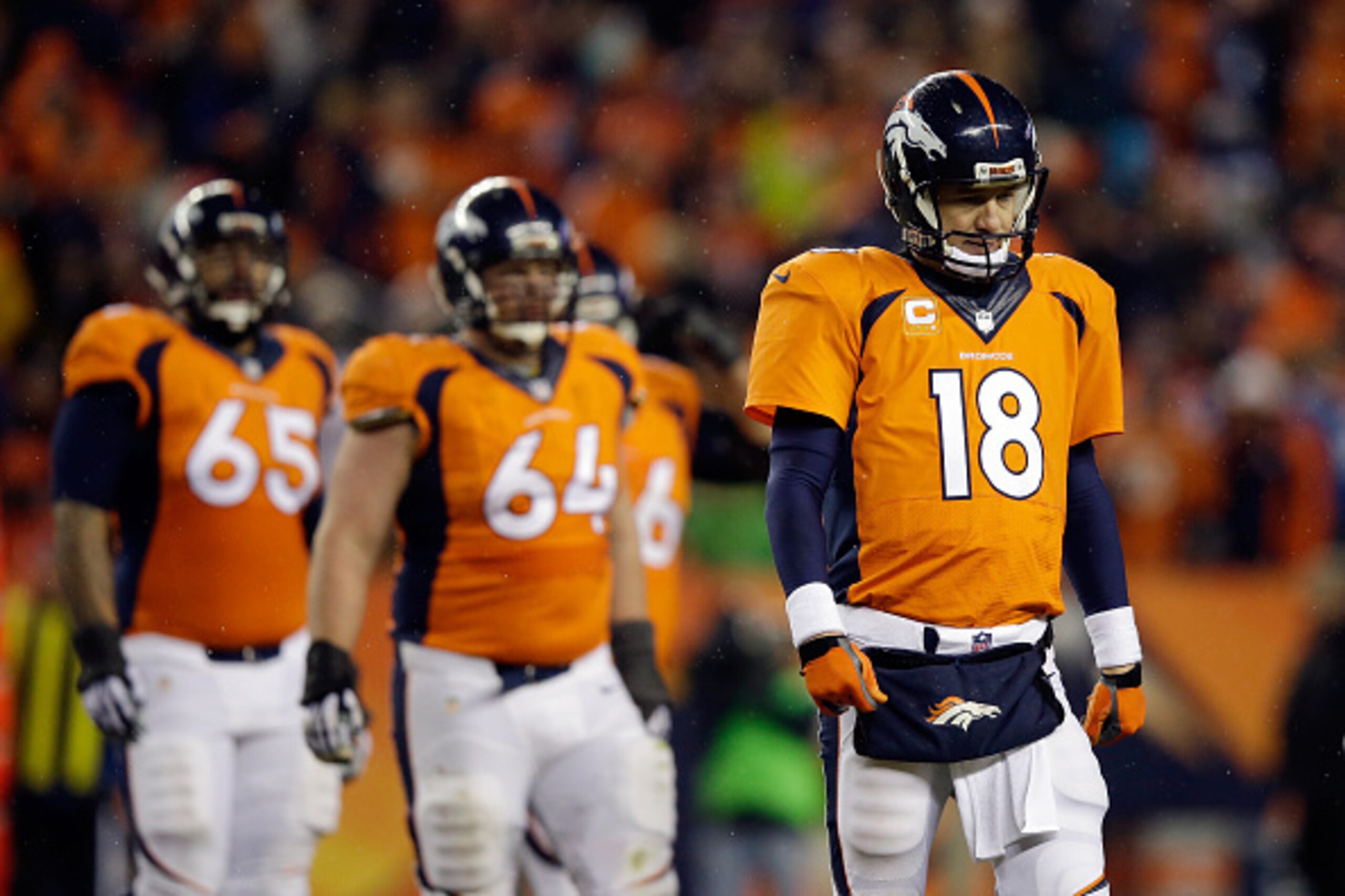 DENVER, CO - JANUARY 11: Peyton Manning #18 of the Denver Broncos reacts in the fourth quarter against the Indianapolis Colts during a 2015 AFC Divisional Playoff game at Sports Authority Field at Mile High on January 11, 2015 in Denver, Colorado. The Col