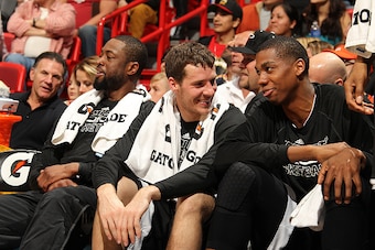 MIAMI, FL - FEBRUARY 21:  Dwyane Wade #3, Goran Dragic #7 and Hassan Whiteside #21 of the Miami Heat during the game against the New Orleans Pelicans on February 21, 2015 at AmericanAirlines Arena in Miami, Florida. NOTE TO USER: User expressly acknowledg