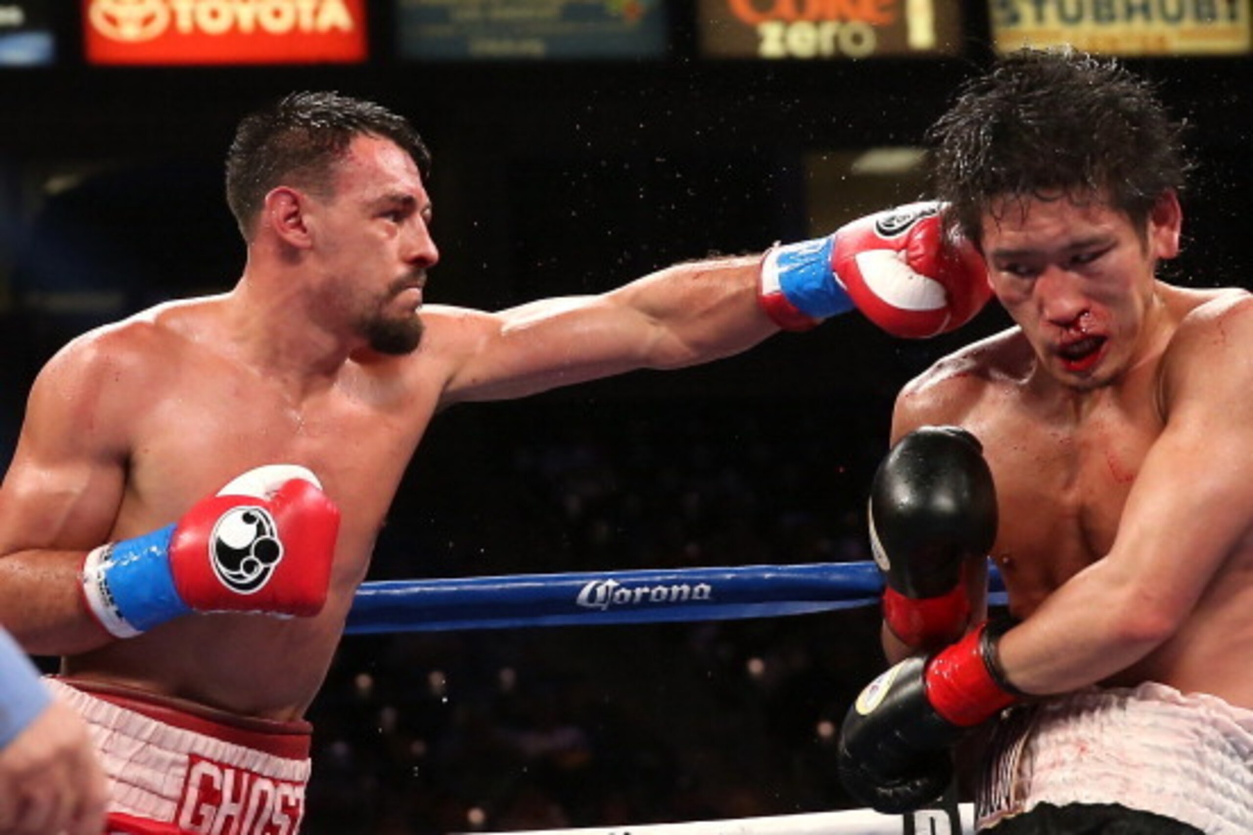 LOS ANGELES, CA - JUNE 21:  Robert Guerrero (R) lands a punch on Yoshihiro Kamegai in their welterweight bout at StubHub Center on June 21, 2014 in Los Angeles, California.  Guerrero won by unanimous decision.  (Photo by Stephen Dunn/Getty Images)