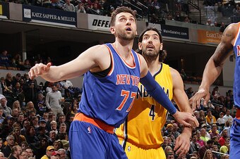 INDIANAPOLIS, IN - MARCH 4:  Andrea Bargnani #77 of the New York Knicks boxes out against Luis Scola #4 of the Indiana Pacers during the game on March 4, 2015 at Bankers Life Fieldhouse in Indianapolis, Indiana. NOTE TO USER: User expressly acknowledges a