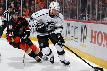 ANAHEIM, CA - FEBRUARY 27:  Andrej Sekera #7 of the Los Angeles Kings controls the puck with Kyle Palmieri #21 of the Anaheim Ducks trailing on February 27, 2015 at Honda Center in Anaheim, California. (Photo by Debora Robinson/NHLI via Getty Images)