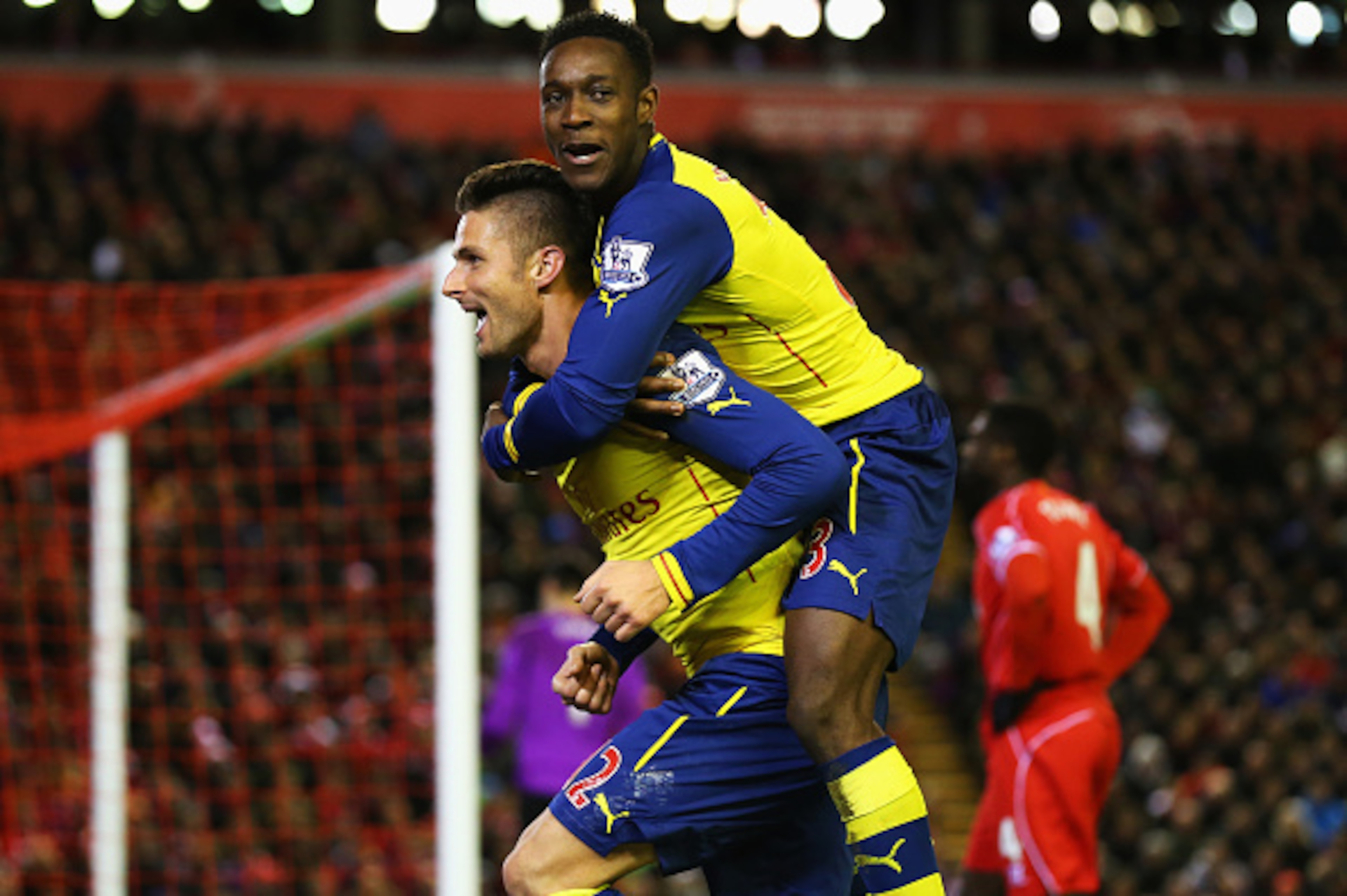 LIVERPOOL, ENGLAND - DECEMBER 21: Olivier Giroud of Arsenal celebrates scoring his goal with Danny Welbeck of Arsenal during the Barclays Premier League match between Liverpool and Arsenal at Anfield on December 21, 2014 in Liverpool, England.  (Photo by 
