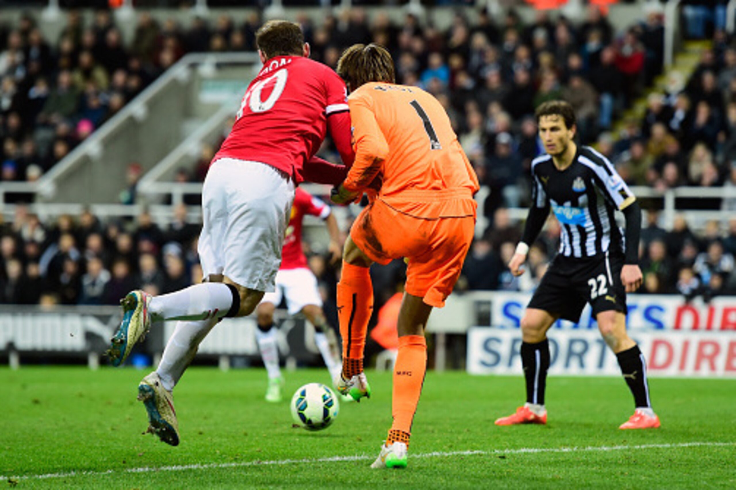 NEWCASTLE UPON TYNE, ENGLAND - MARCH 04:  Newcastle goalkeeper Tim Krul is challenged by Wayne Rooney off the ball as Ashley Young (obscured) scores the opening goal during the Barclays Premier League match between Newcastle United and Manchester United a