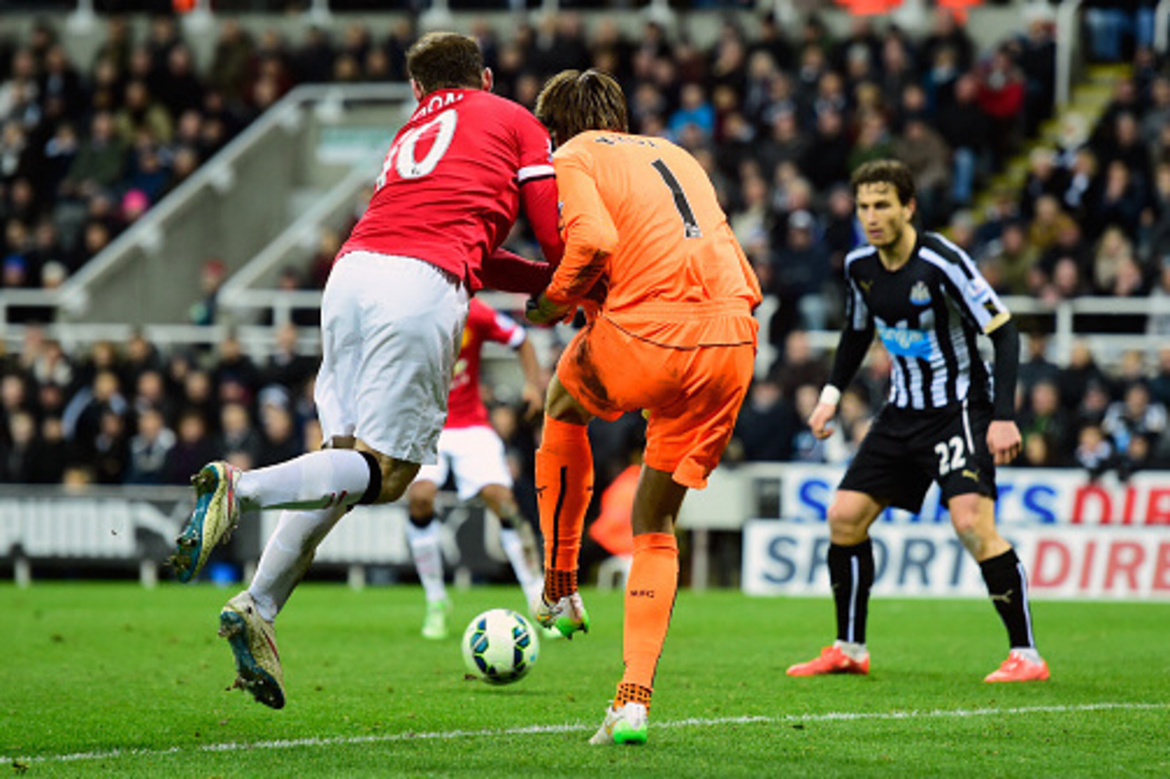 NEWCASTLE UPON TYNE, ENGLAND - MARCH 04:  Newcastle goalkeeper Tim Krul is challenged by Wayne Rooney off the ball as Ashley Young (obscured) scores the opening goal during the Barclays Premier League match between Newcastle United and Manchester United a
