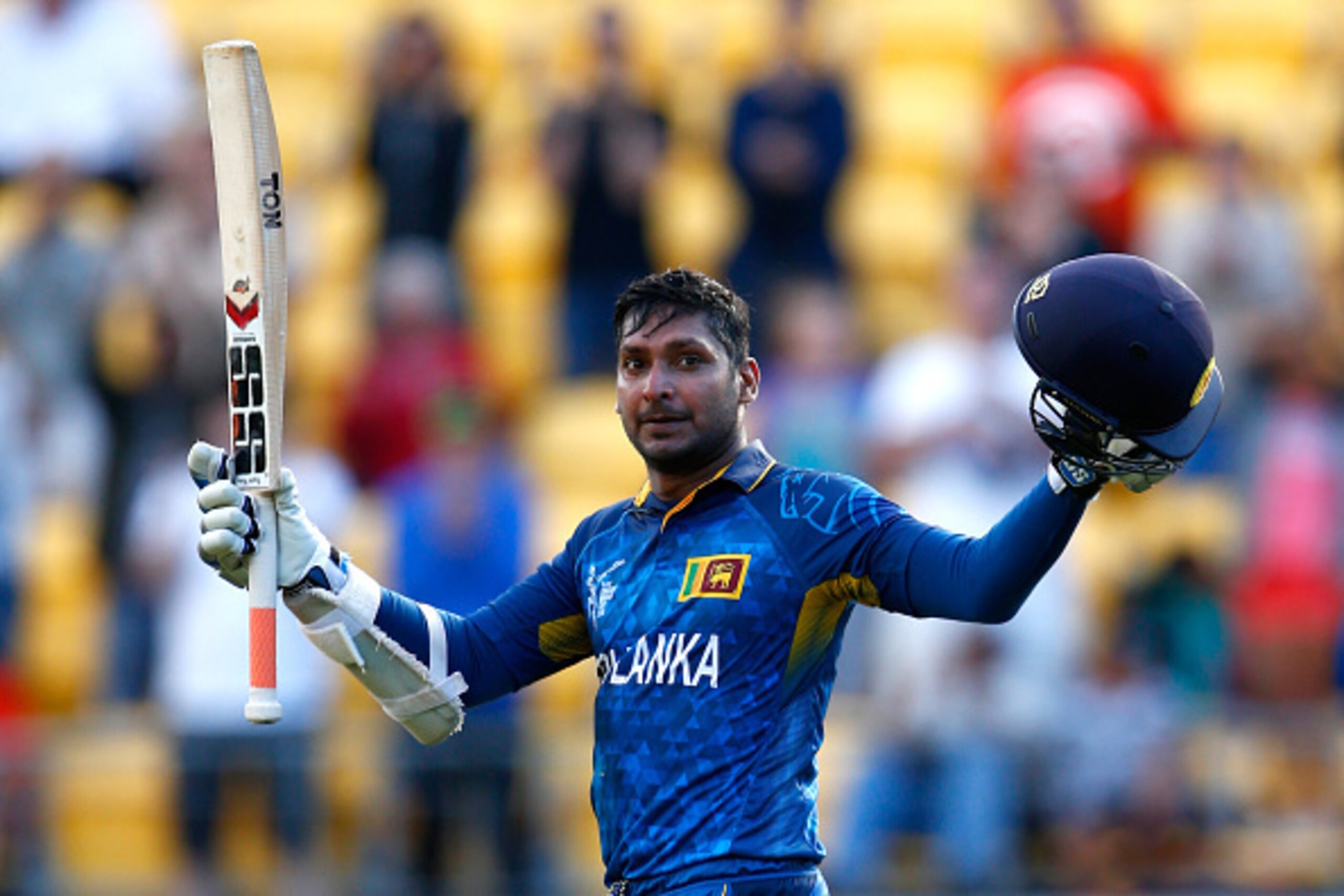 WELLINGTON, NEW ZEALAND - MARCH 01: Kumar Sangakkara of Sri Lanka celebrates his century during the 2015 ICC Cricket World Cup match between England and Sri Lanka at Wellington Regional Stadium on March 1, 2015 in Wellington, New Zealand. (Photo by Phil WELLINGTON, NEW ZEALAND - MARCH 01: Kumar Sangakkara of Sri Lanka celebrates his century during the 2015 ICC Cricket World Cup match between England and Sri Lanka at Wellington Regional Stadium on March 1, 2015 in Wellington, New Zealand. (Photo by Phil