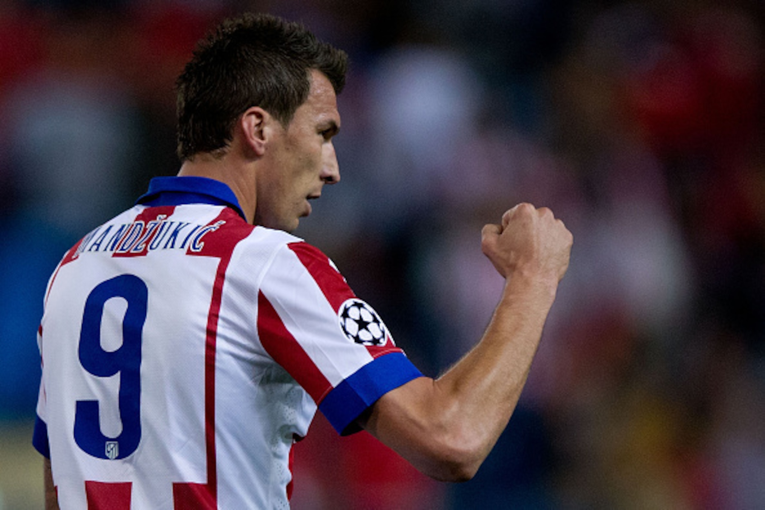 MADRID, SPAIN - OCTOBER 22: Mario Mandzukic of Atletico de Madrid celebrates scoring their second goal during the UEFA Champions League group A match between Club Atletico de Madrid and Malmo FF at Vicente Calderon stadium on October 22, 2014 in Madrid, S