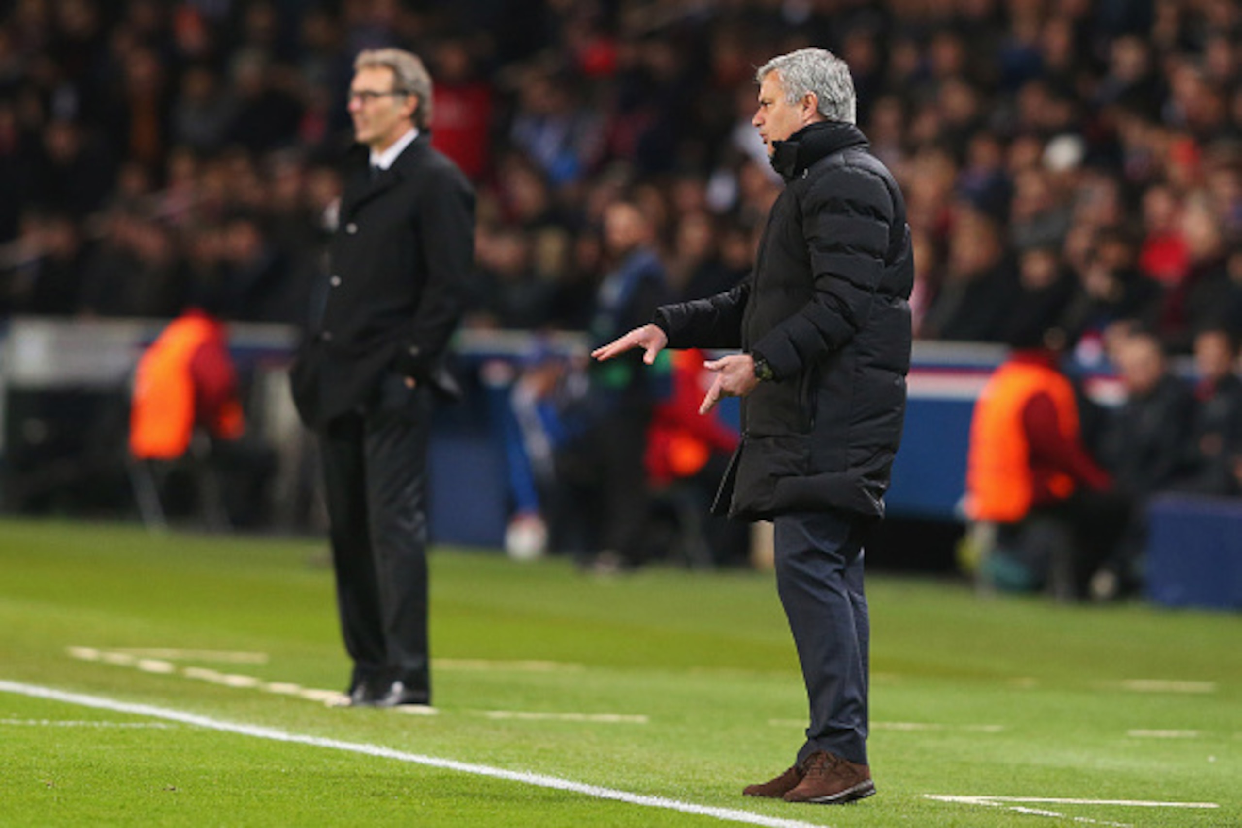 PARIS, FRANCE - FEBRUARY 17:  Jose Mourinho manager of Chelsea and Laurent Blanc manager of Paris Saint-Germain (L) look on during the UEFA Champions League Round of 16 match between Paris Saint-Germain and Chelsea at Parc des Princes on February 17, 2015