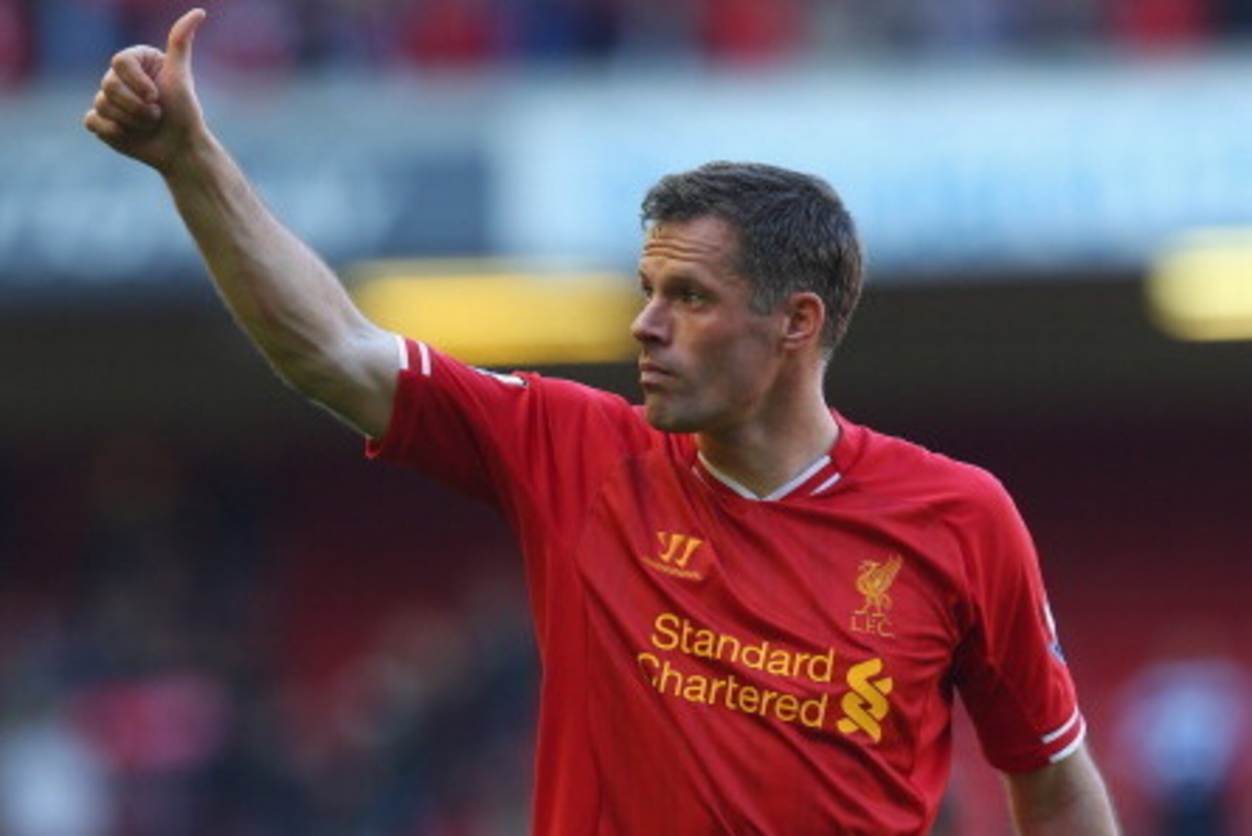 LIVERPOOL, ENGLAND - MAY 19:  Jamie Carragher of Liverpool acknowledges the fans after his last game for the club following the Barclays Premier League match between Liverpool and Queens Park Rangers at Anfield on May 19, 2013 in Liverpool, England.  (Pho