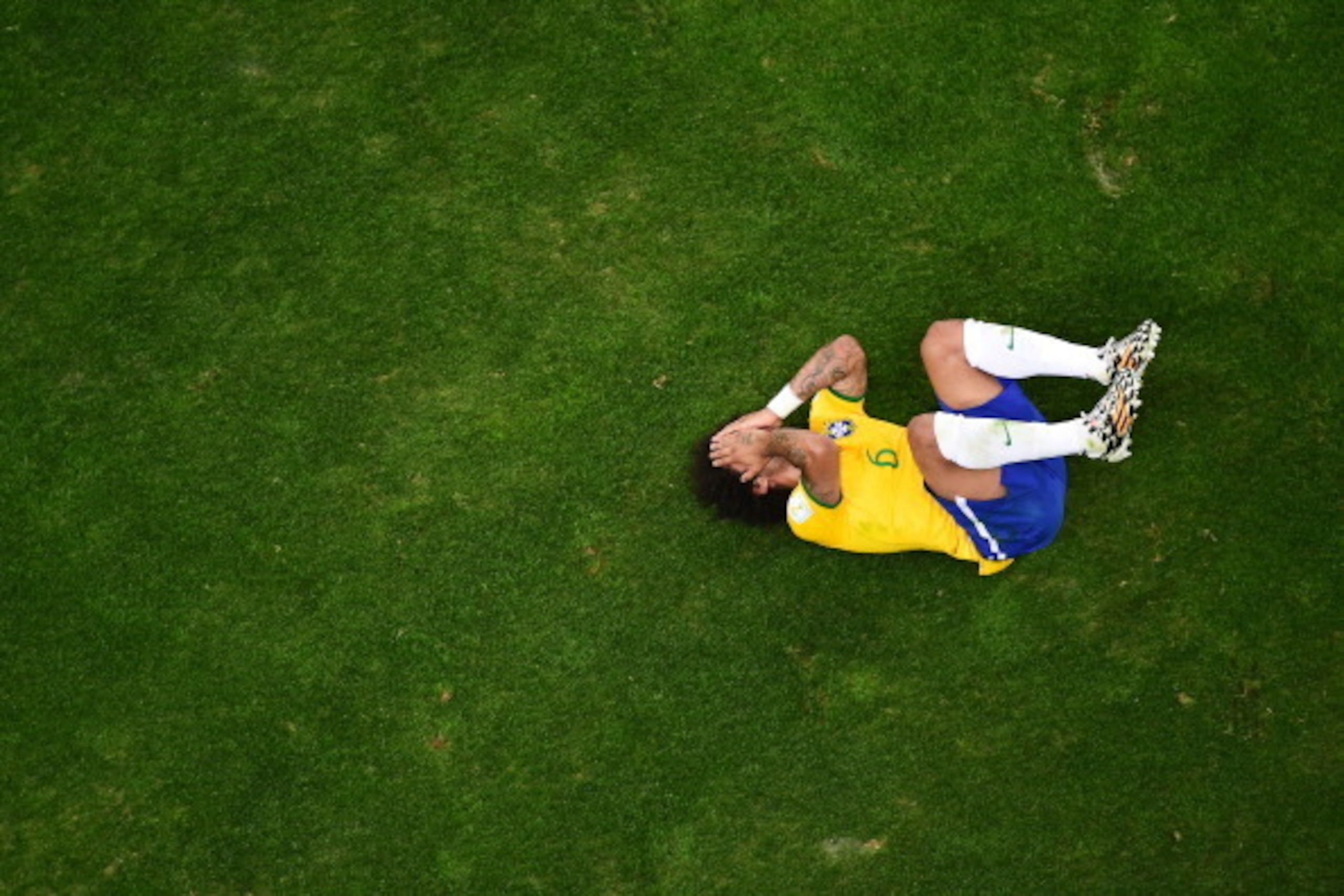 BELO HORIZONTE, BRAZIL - JULY 08:  Marcelo of Brazil reacts during the 2014 FIFA World Cup Brazil Semi Final match between Brazil and Germany at Estadio Mineirao on July 8, 2014 in Belo Horizonte, Brazil.  (Photo by Francois Xavier Marit - Pool/Getty Imag