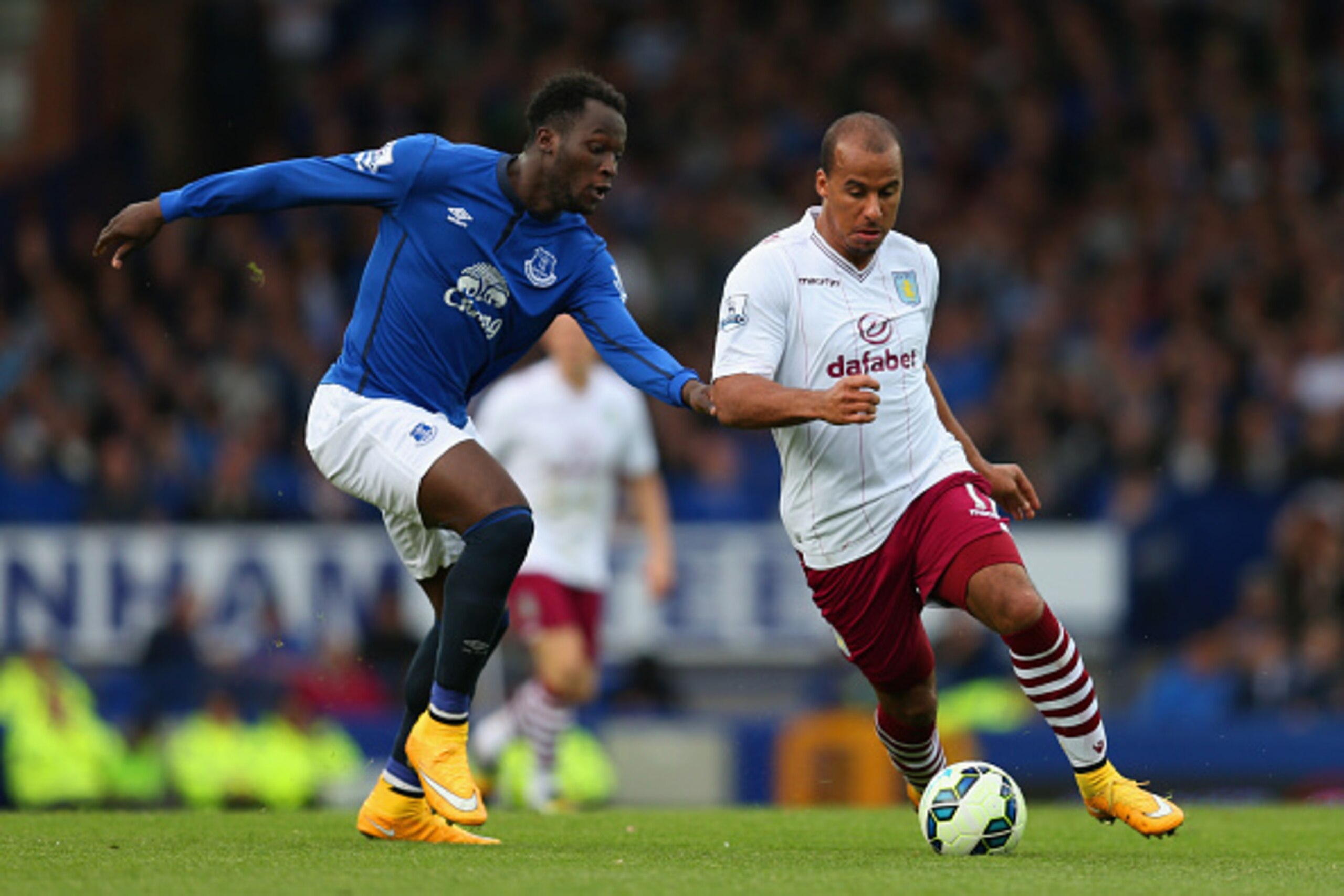 LIVERPOOL, ENGLAND - OCTOBER 18: Romelu Lukaku of Everton and Gabriel Agbonlahor of Aston Villa compete for the ball during the Barclays Premier League match between Everton and Aston Villa at Goodison Park on October 18, 2014 in Liverpool, England.  (Pho