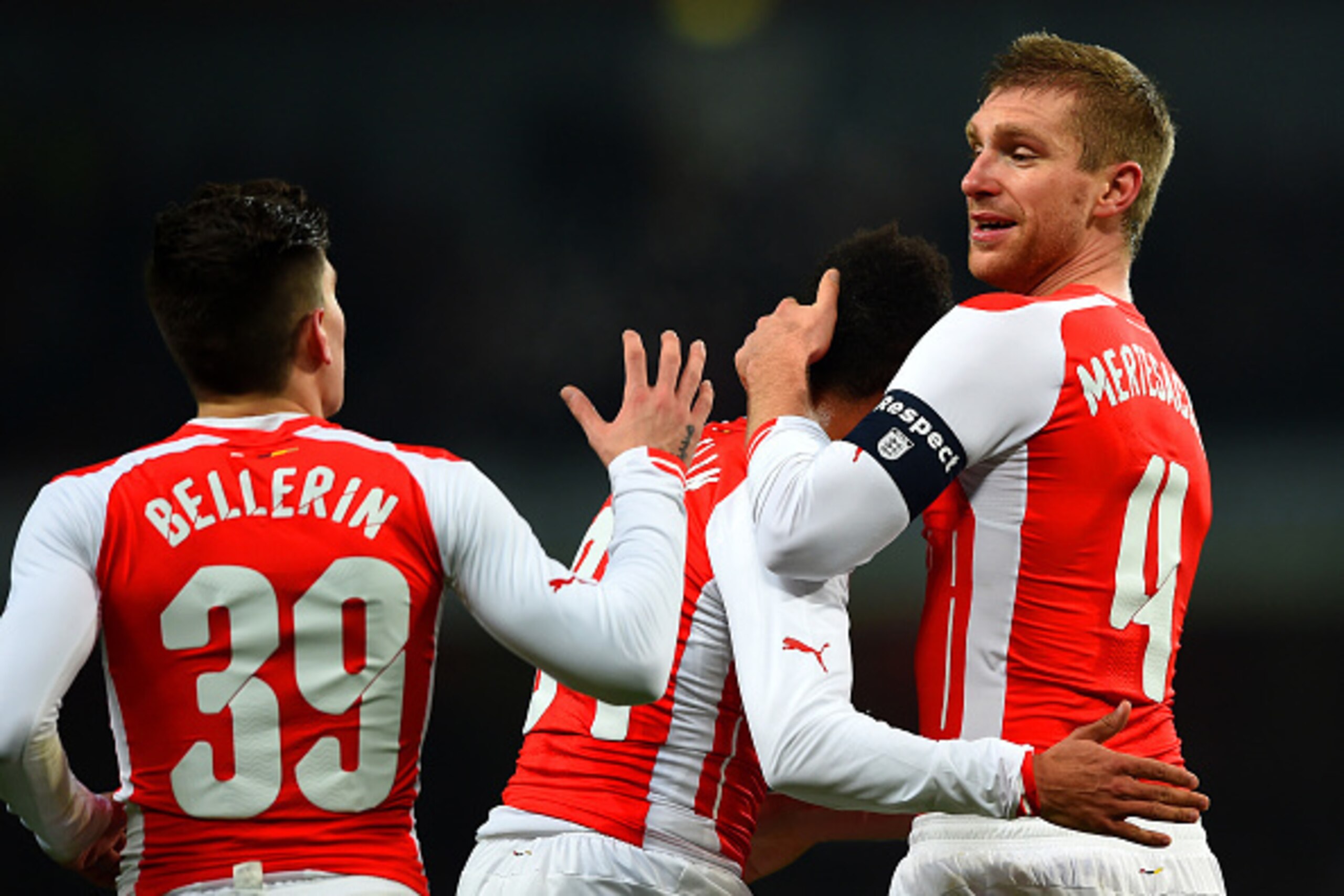 LONDON, ENGLAND - JANUARY 04:  Per Mertesacker of Arsenal celebrates with team-mates after scoring the opening goal during the FA Cup Third Round match between Arsenal and Hull City at Emirates Stadium on January 4, 2015 in London, England.  (Photo by Pau