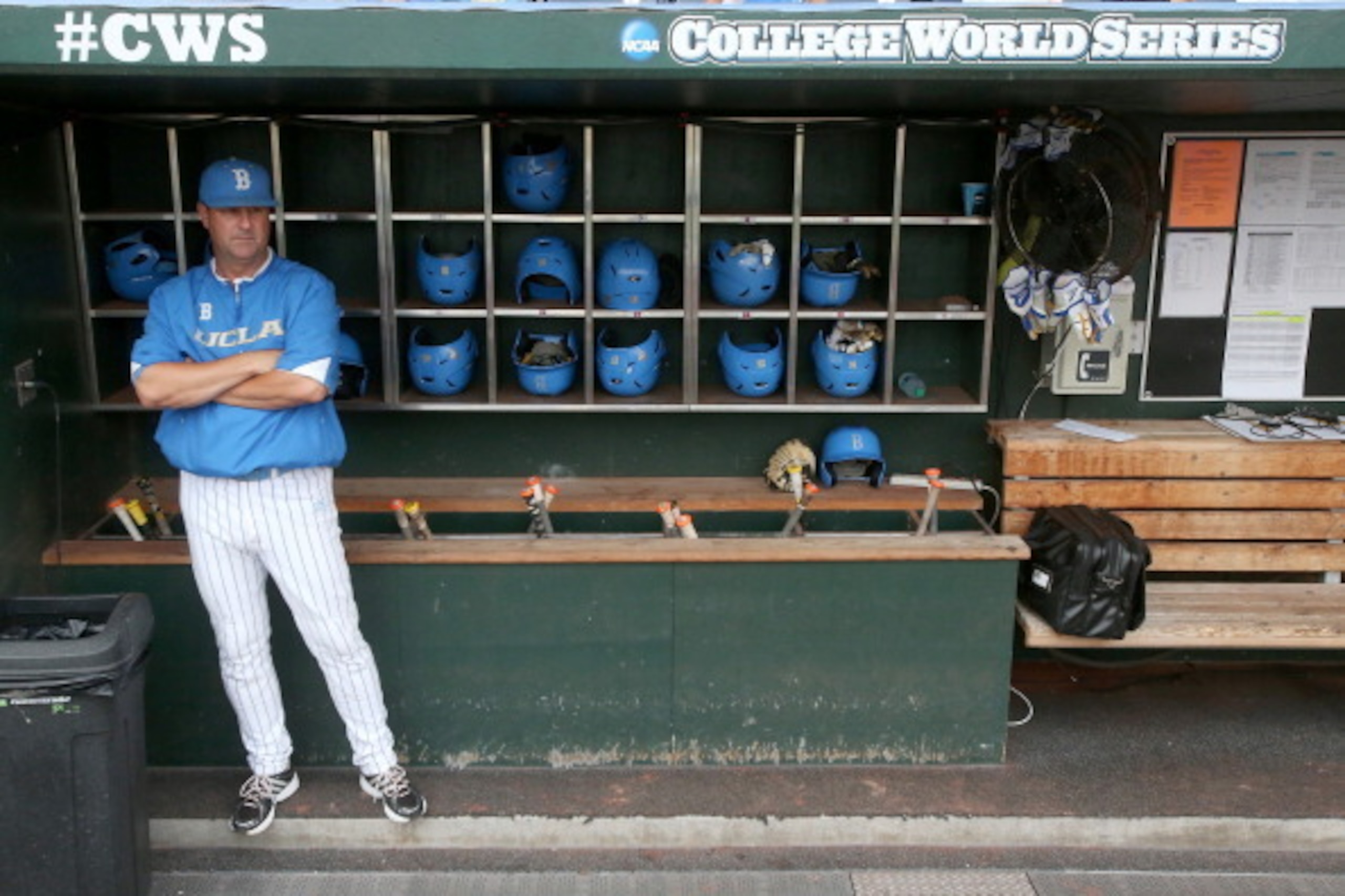 OMAHA, NE - JUNE 25: Head coach John Savage of the UCLA Bruins stands in the dugout before playing the Mississippi State Bulldogs during game two of the College World Series Finals on June 25, 2013 at TD Ameritrade Park in Omaha, Nebraska.  (Photo by Step