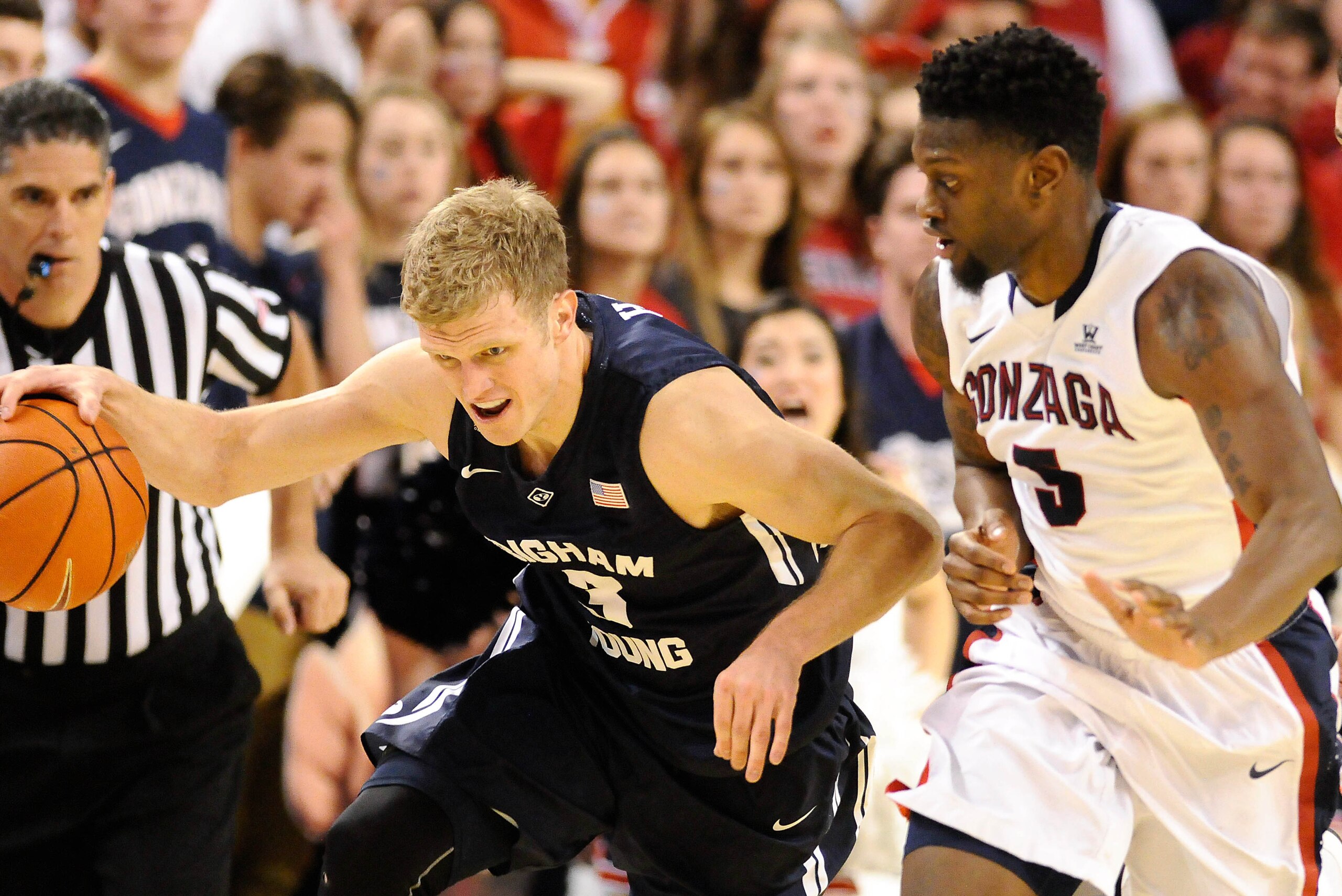 Feb 28, 2015; Spokane, WA, USA; Brigham Young Cougars guard Tyler Haws (3) is chased down by Gonzaga Bulldogs guard Kyle Dranginis (3) during the second half at McCarthey Athletic Center. The Cougars won 73-70. Mandatory Credit: James Snook-USA TODAY Spor