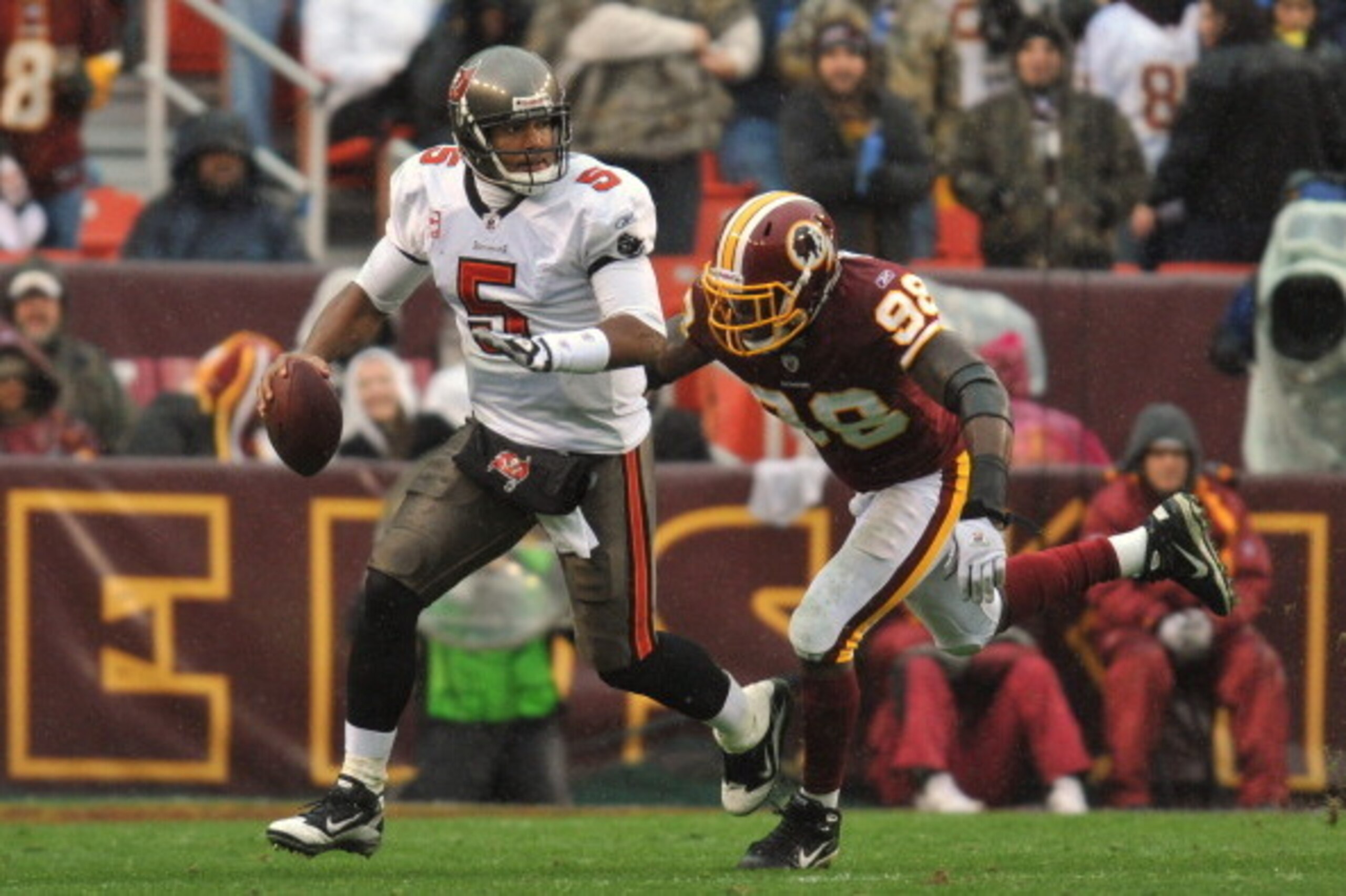 LANDOVER, MD - DECEMBER 12: Josh Freeman #5 of the Tampa Bay Buccaneers is chased by Brian Orakpo #98 of the Washington Redskins at FedExField on December 12, 2010 in Landover, Maryland. The Redskins led the Buccaneers at the half 10-3 00-00. (Photo by L LANDOVER, MD - DECEMBER 12: Josh Freeman #5 of the Tampa Bay Buccaneers is chased by Brian Orakpo #98 of the Washington Redskins at FedExField on December 12, 2010 in Landover, Maryland. The Redskins led the Buccaneers at the half 10-3 00-00. (Photo by L