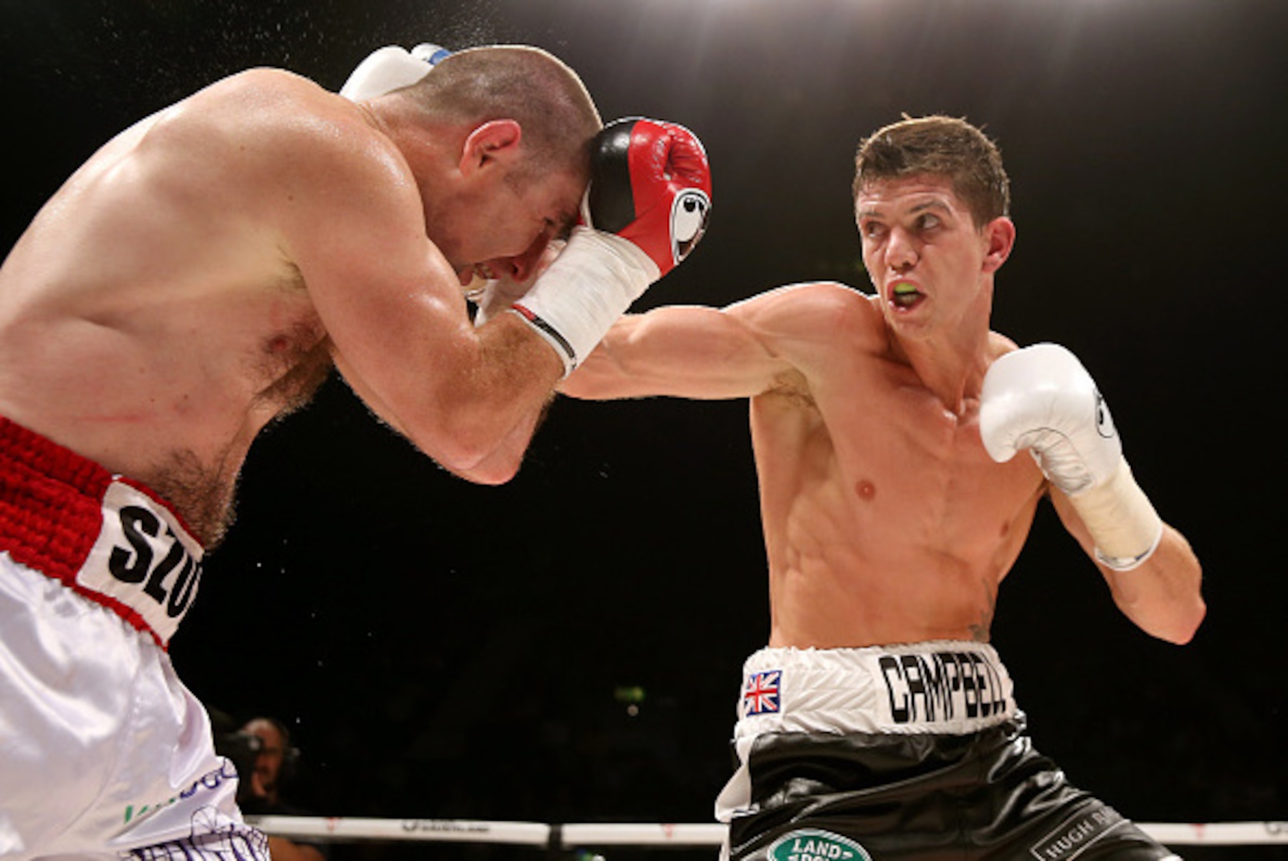 LONDON, ENGLAND - SEPTEMBER 20:  Luke Campbell in action with Krzysztof Szot during their Lightweight bout at Wembley Arena on September 20, 2014 in London, England.  (Photo by Scott Heavey/Getty Images)