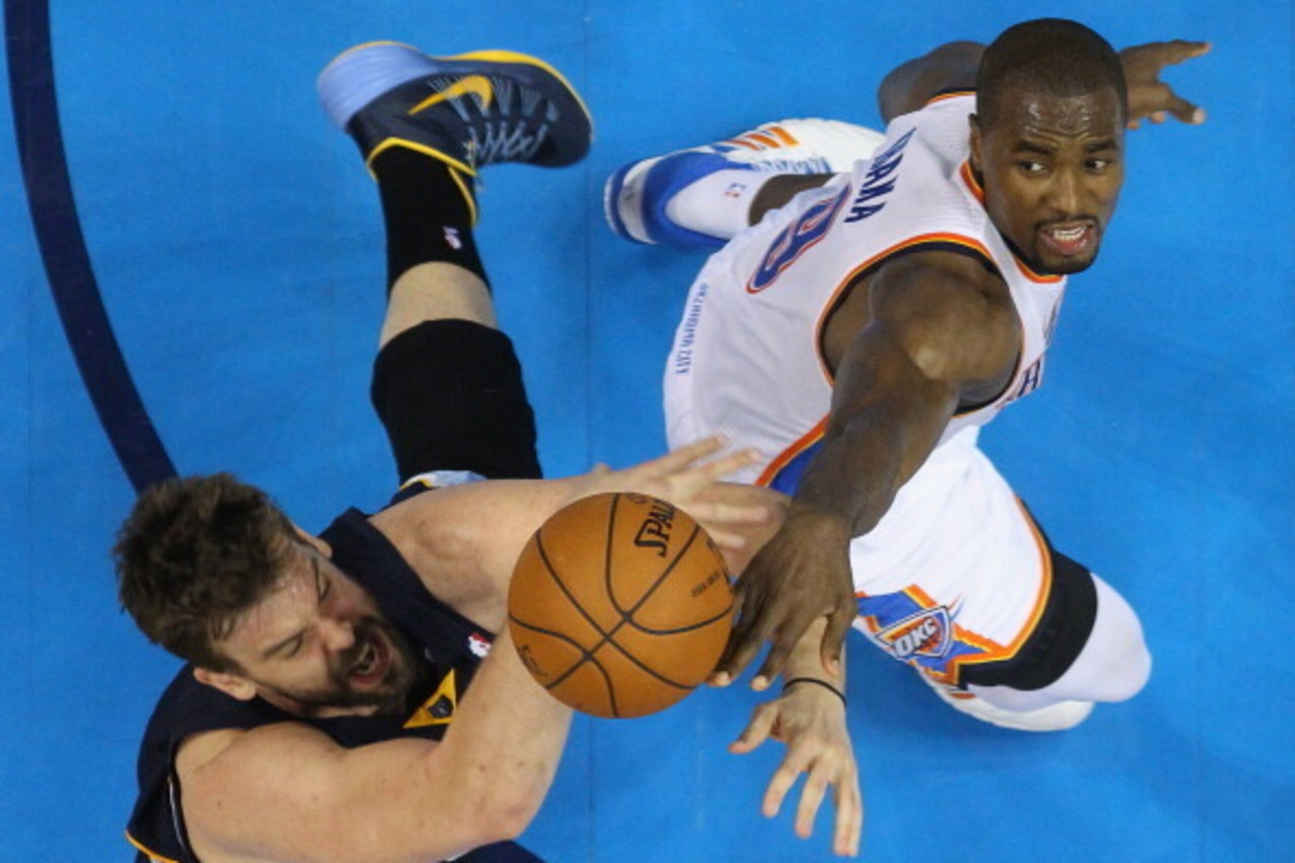 OKLAHOMA CITY, OK - APRIL 19:  Serge Ibaka #9 of the Oklahoma City Thunder blocks a shot by Marc Gasol #33 of the Memphis Grizzlies in Game One of the Western Conference Quarterfinals during the 2014 NBA Playoffs at Chesapeake Energy Arena on April 19, 20