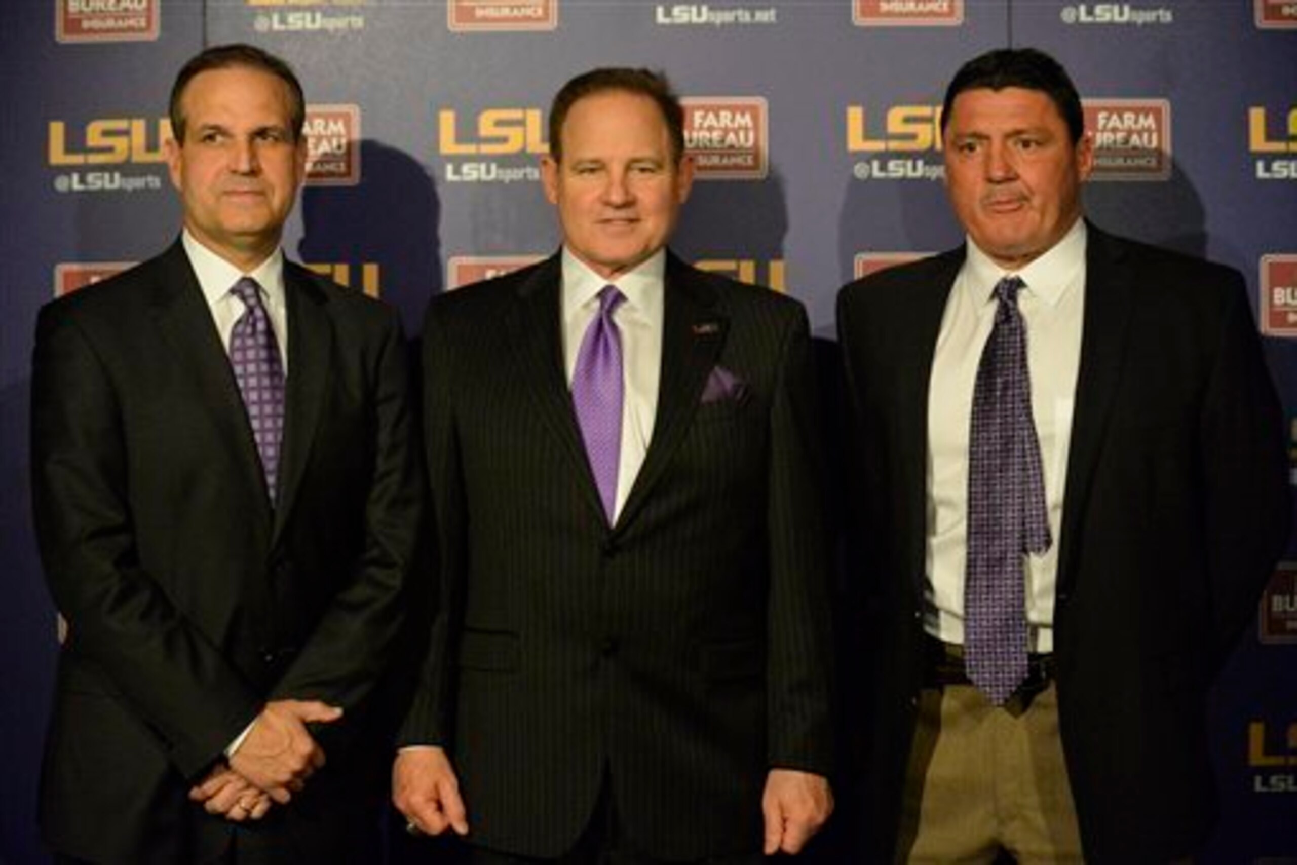 LSU DC Kevin Steele (center), HC Les Miles (center) and DL coach Ed Orgeron (right)