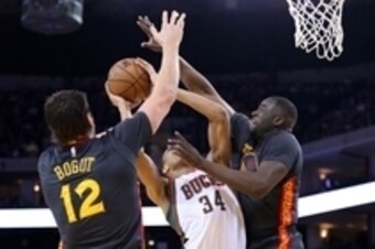 Mar 4, 2015; Oakland, CA, USA; Golden State Warriors center Andrew Bogut (12) and forward Draymond Green (23) defend Milwaukee Bucks forward Giannis Antetokounmpo (34) during the first quarter at Oracle Arena. Mandatory Credit: Kelley L Cox-USA TODAY Spor