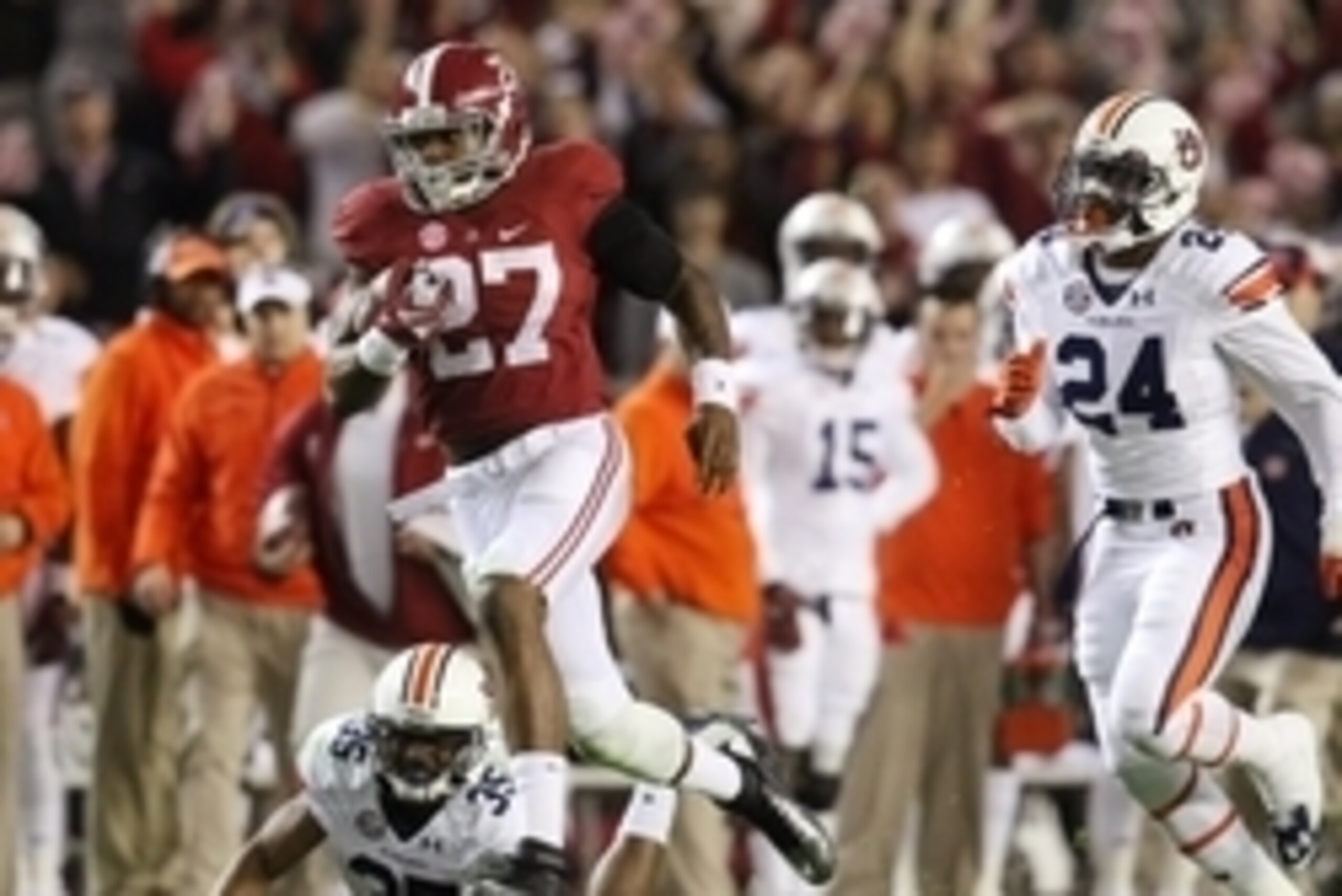 Nov 29, 2014; Tuscaloosa, AL, USA; Alabama Crimson Tide running back Derrick Henry (27) carries the ball past Auburn Tigers defensive back Joe Turner (35) and Derrick Moncrief (24) in the fourth quarter at Bryant-Denny Stadium. Mandatory Credit: Marvin G Nov 29, 2014; Tuscaloosa, AL, USA; Alabama Crimson Tide running back Derrick Henry (27) carries the ball past Auburn Tigers defensive back Joe Turner (35) and Derrick Moncrief (24) in the fourth quarter at Bryant-Denny Stadium. Mandatory Credit: Marvin G