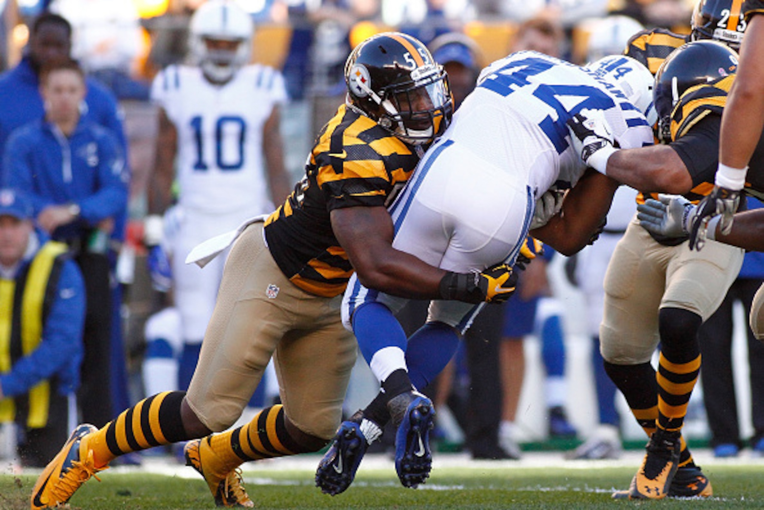 PITTSBURGH, PA - OCTOBER 26:  Ahmad Bradshaw #44 of the Indianapolis Colts gets wrapped up by Arthur Moats #55 of the Pittsburgh Steelers during the first quarter at Heinz Field on October 26, 2014 in Pittsburgh, Pennsylvania.  (Photo by Justin K. Aller/G