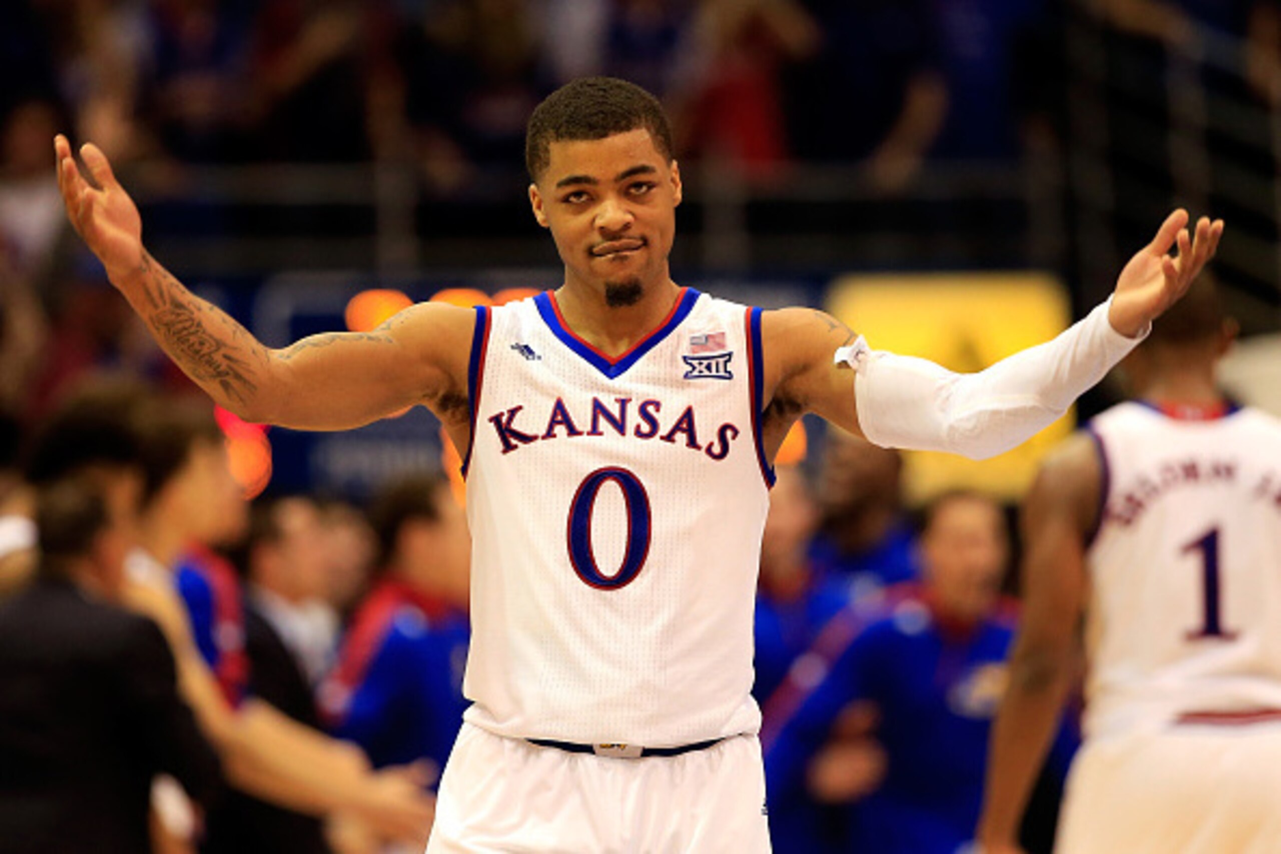 LAWRENCE, KS - MARCH 03:  Frank Mason III #0 of the Kansas Jayhawks celebrates as the Jayhawks defeat the West Virginia Mountaineers 76-69 in overtime to win the game and clinch their eleventh straight Big IX Championship title at Allen Fieldhouse on Marc