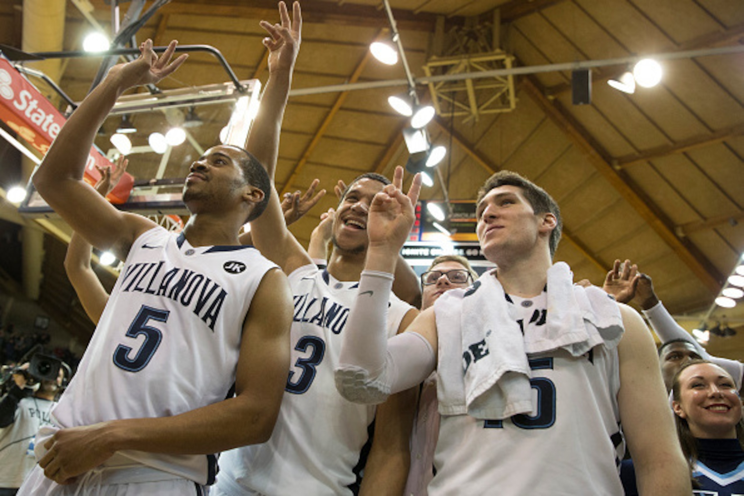 VILLANOVA, PA - FEBRUARY 16: Phil Booth #5, Josh Hart #3, and Ryan Arcidiacono #15 of the Villanova Wildcats sing the team's fight song after the game against the Seton Hall Pirates on February 16, 2015 at the Pavilion in Villanova, Pennsylvania.  The Wil
