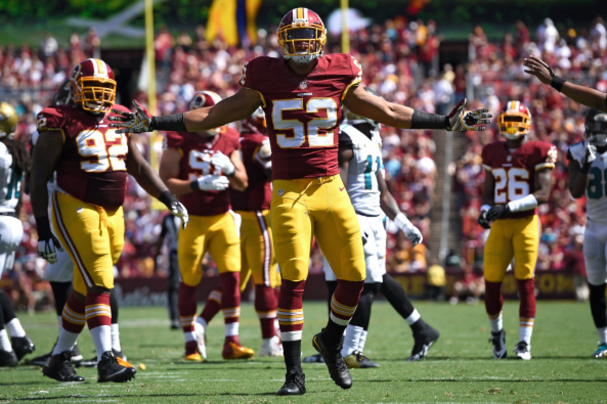 LANDOVER, MD - SEPTEMBER 14: Inside linebacker Keenan Robinson #52 of the Washington Redskins celebrates a tackle against the Jacksonville Jaguars at FedExField on September 14, 2014 in Landover, Maryland. The Washington Redskins won, 41-10. (Photo by Pat