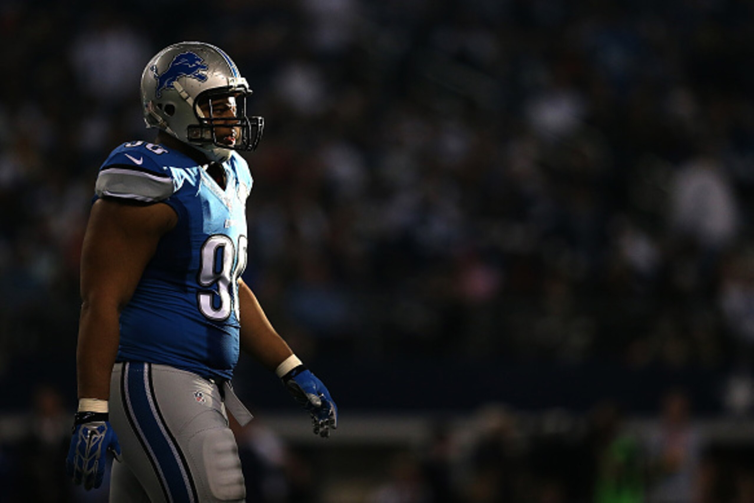 ARLINGTON, TX - JANUARY 04:  Ndamukong Suh #90 of the Detroit Lions looks on during a NFC Wild Card Playoff game against the Dallas Cowboys at AT&T Stadium on January 4, 2015 in Arlington, Texas.  (Photo by Sarah Glenn/Getty Images)