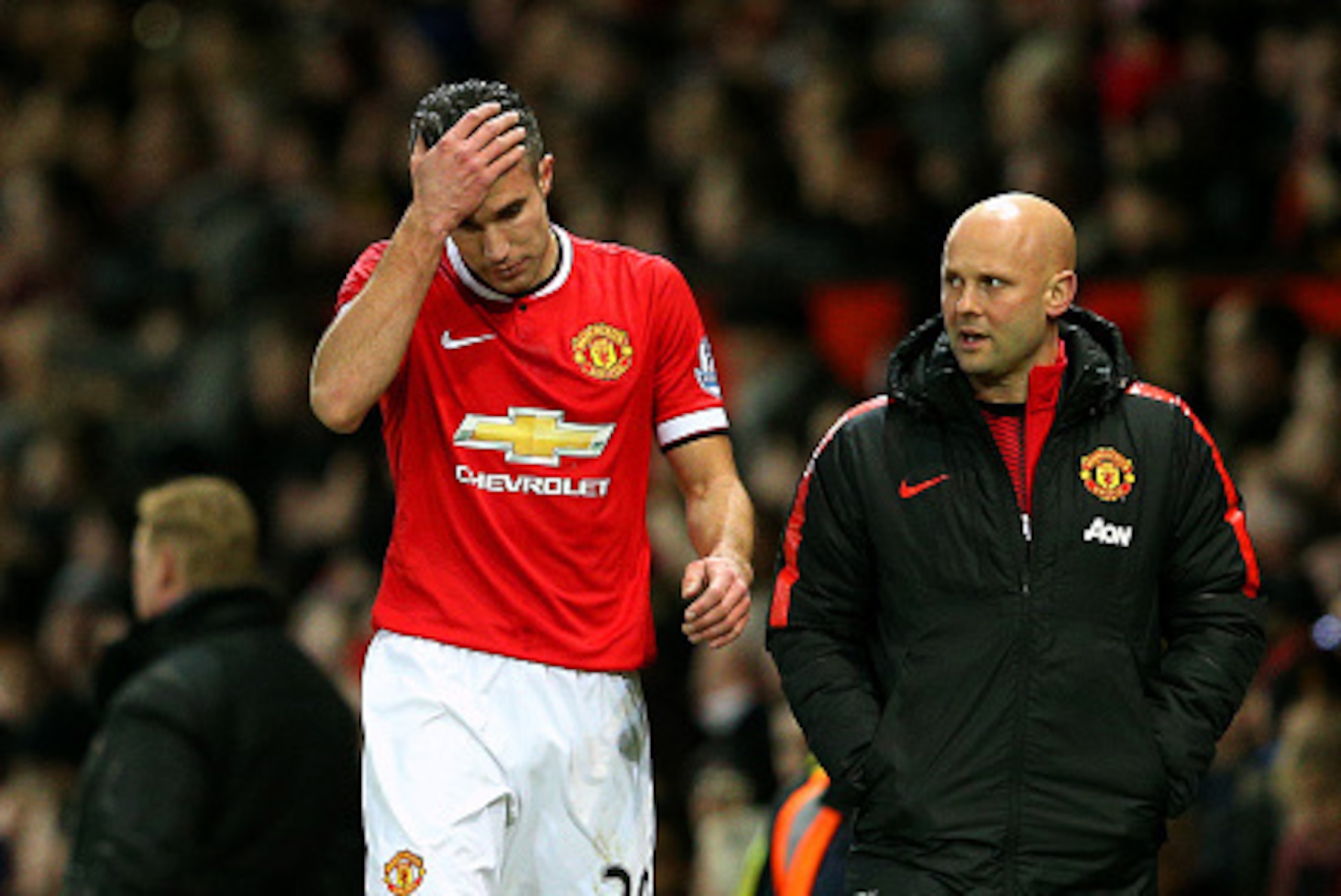 MANCHESTER, ENGLAND - JANUARY 11:  Robin van Persie of Manchester United reacts as he leaves the pitch during the Barclays Premier League match between Manchester United and Southampton at Old Trafford on January 11, 2015 in Manchester, England.  (Photo b