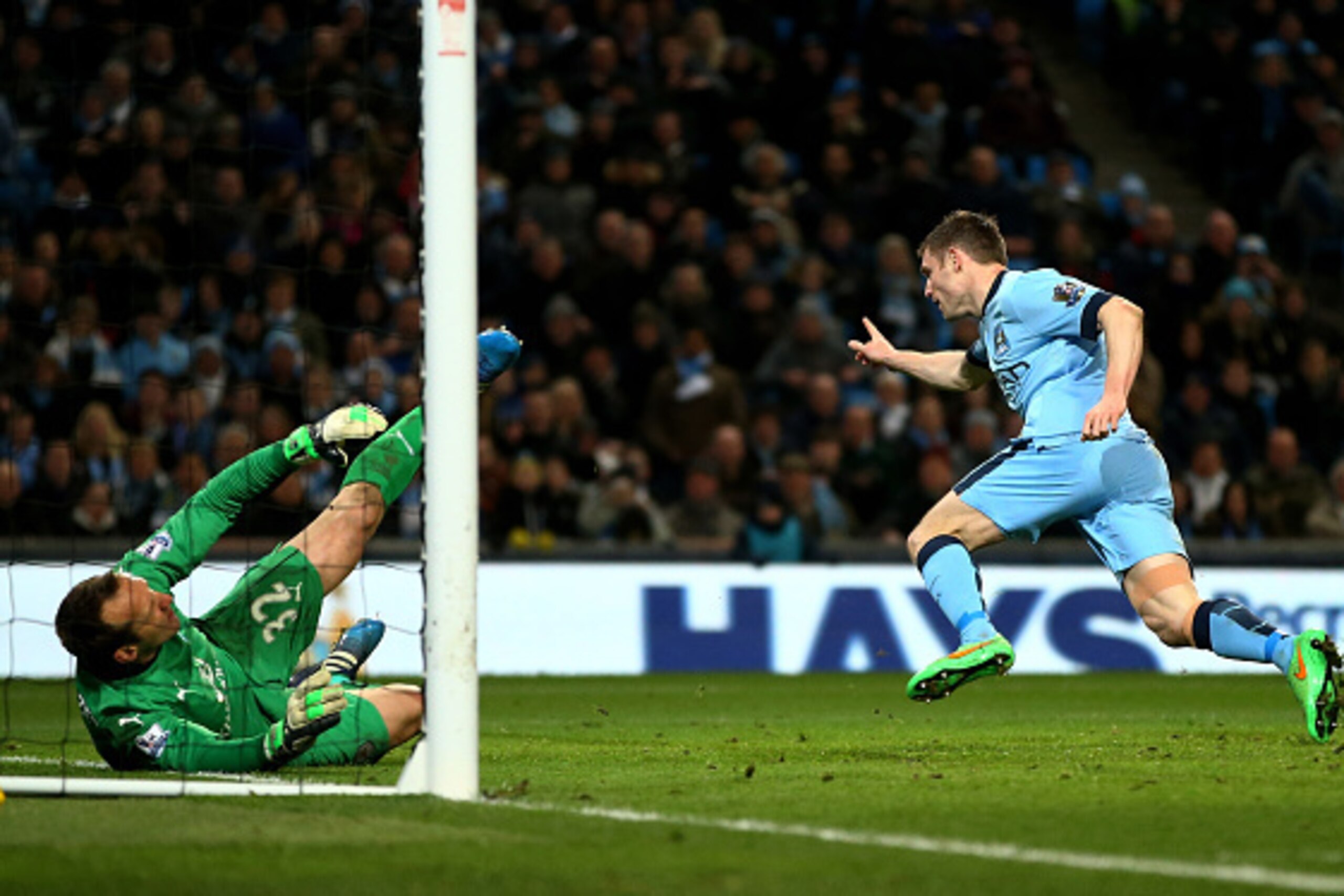 MANCHESTER, ENGLAND - MARCH 04:  James Milner of Manchester City celebrates after scoring his team's second goal past goalkeeper Mark Schwarzer of Leicester City during the Barclays Premier League match between Manchester City and Leicester City at the Et