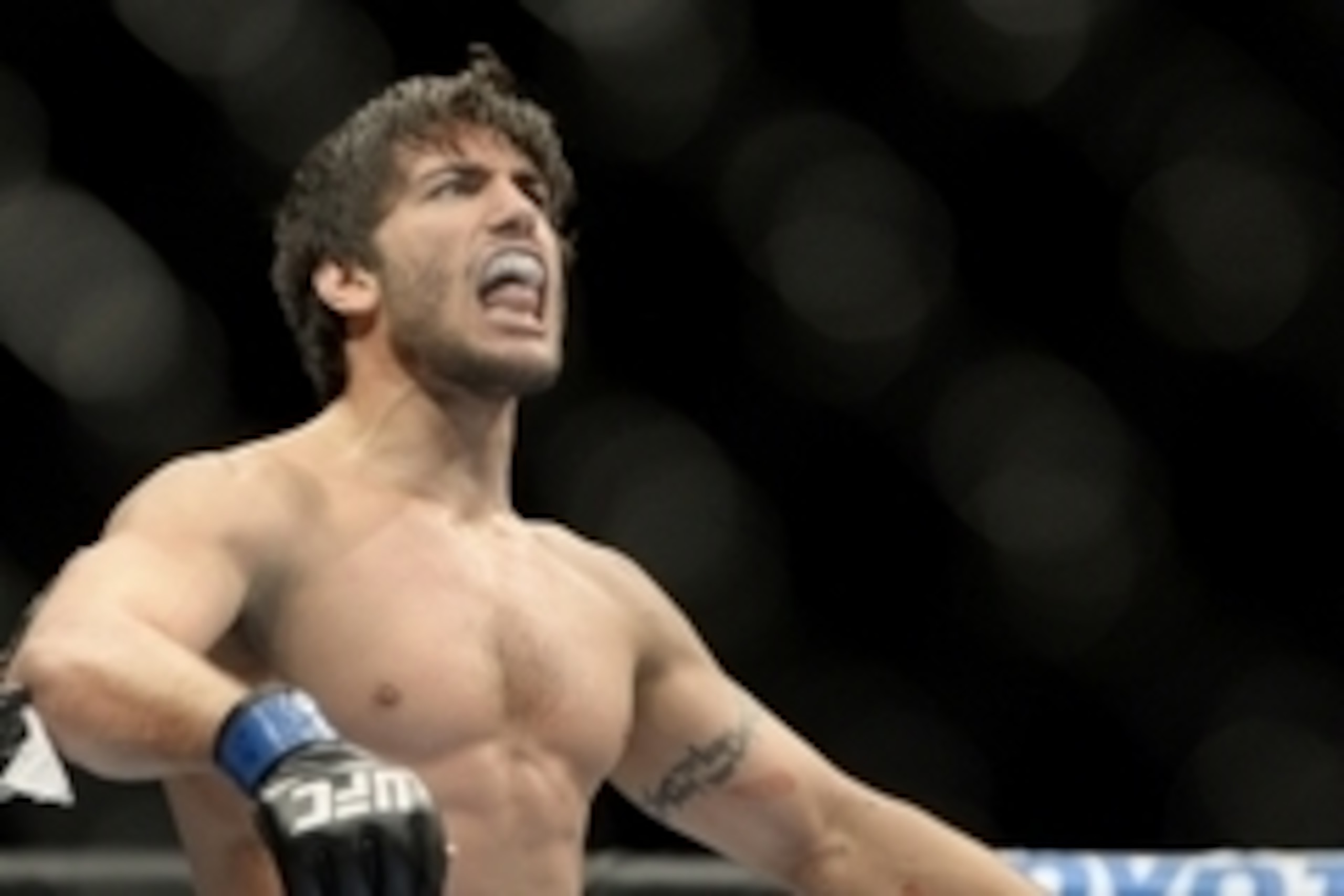 Apr 16, 2014; Quebec City, Quebec, Canada; Elias Theodorou (blue gloves) reacts after his fight against Sheldon Westcott (not pictured) during their middleweight bout at Colisee Pepsi. Mandatory Credit: Eric Bolte-USA TODAY Sports