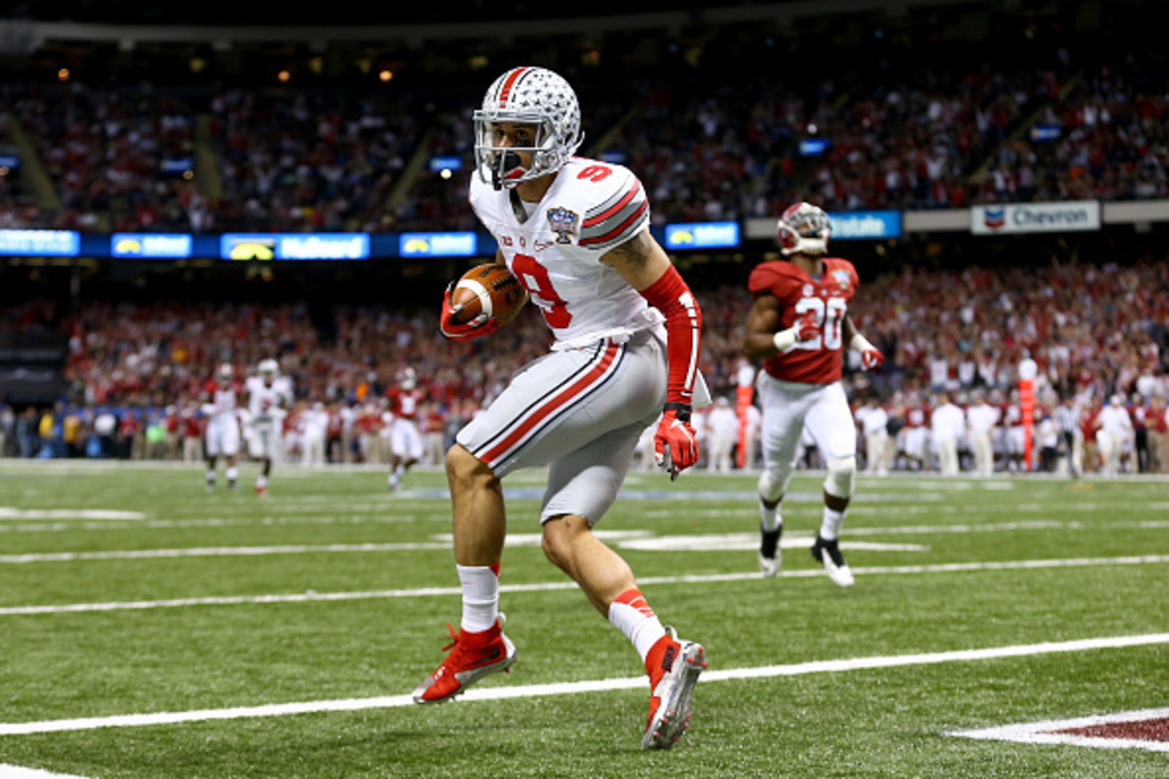 NEW ORLEANS, LA - JANUARY 01: Devin Smith #9 of the Ohio State Buckeyes catches a 47 yard touchdown pass in the third quarter against the Alabama Crimson Tide during the All State Sugar Bowl at the Mercedes-Benz Superdome on January 1, 2015 in New Orlean NEW ORLEANS, LA - JANUARY 01: Devin Smith #9 of the Ohio State Buckeyes catches a 47 yard touchdown pass in the third quarter against the Alabama Crimson Tide during the All State Sugar Bowl at the Mercedes-Benz Superdome on January 1, 2015 in New Orlean