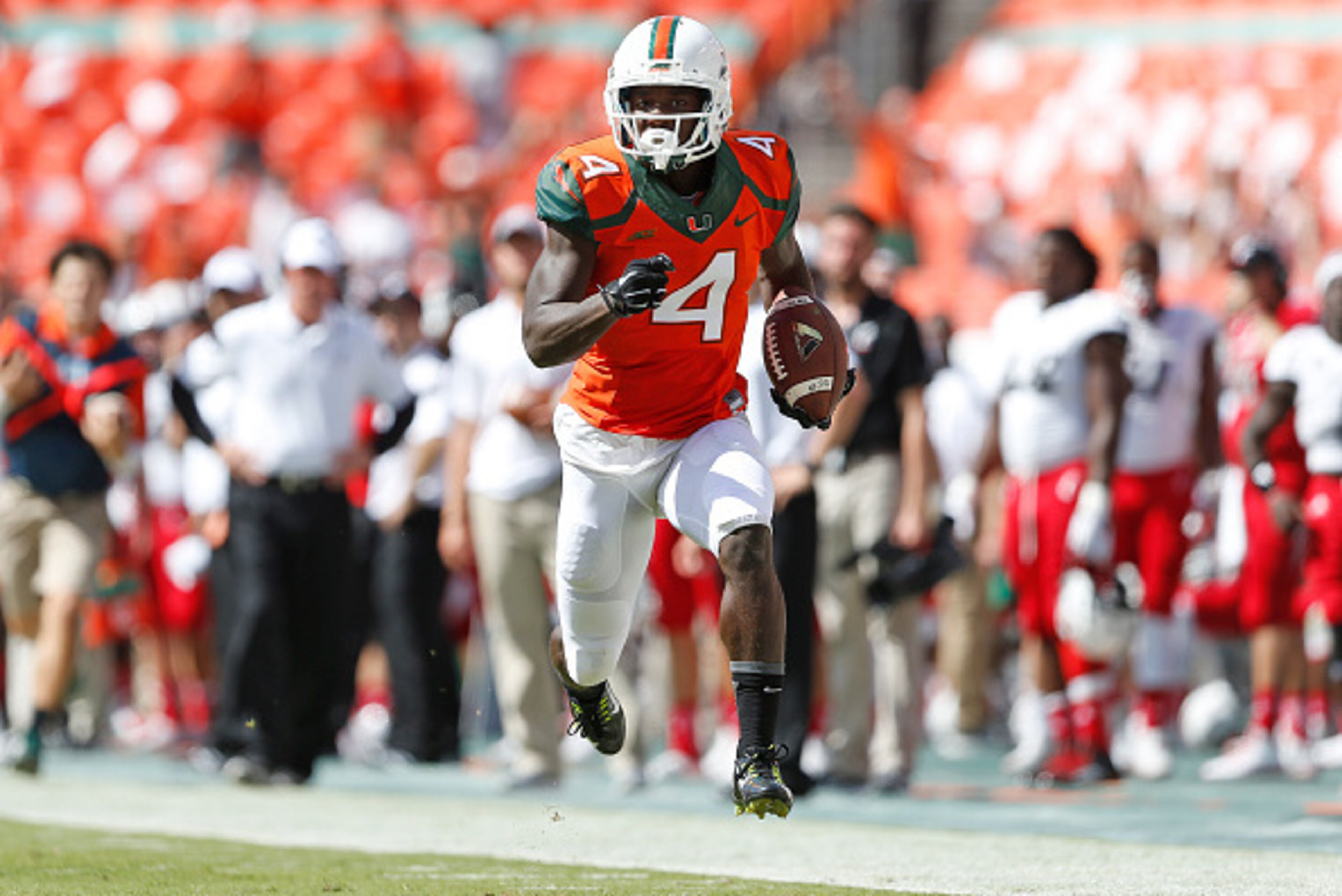 MIAMI GARDENS, FL - OCTOBER 11: Phillip Dorsett #4 of the Miami Hurricanes runs for a third quarter touchdown against the Cincinnati Bearcats on October 11, 2014 at Sun Life Stadium in Miami Gardens, Florida. (Photo by Joel Auerbach/Getty Images) MIAMI GARDENS, FL - OCTOBER 11: Phillip Dorsett #4 of the Miami Hurricanes runs for a third quarter touchdown against the Cincinnati Bearcats on October 11, 2014 at Sun Life Stadium in Miami Gardens, Florida. (Photo by Joel Auerbach/Getty Images)