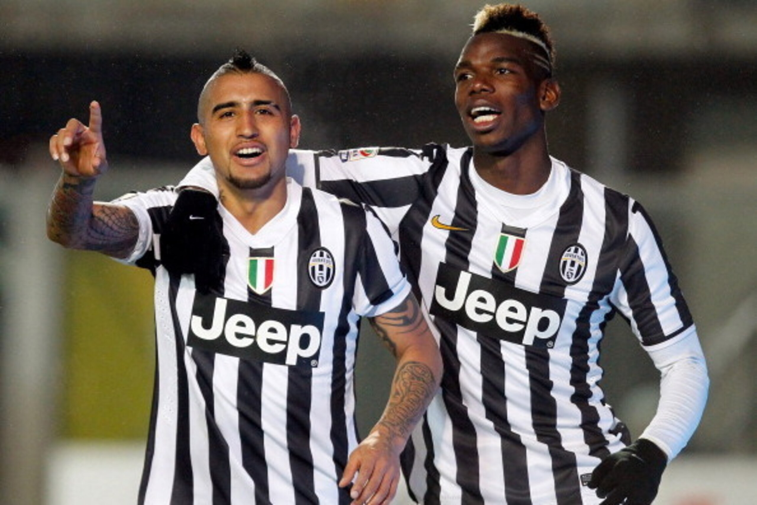 BERGAMO, ITALY - DECEMBER 22:  Arturo Vidal (L) and Paul Pogba of Juventus celebrate the 4th goal during the Serie A match between Atalanta BC and Juventus at Stadio Atleti Azzurri d'Italia on December 22, 2013 in Bergamo, Italy.  (Photo by Maurizio Lagan