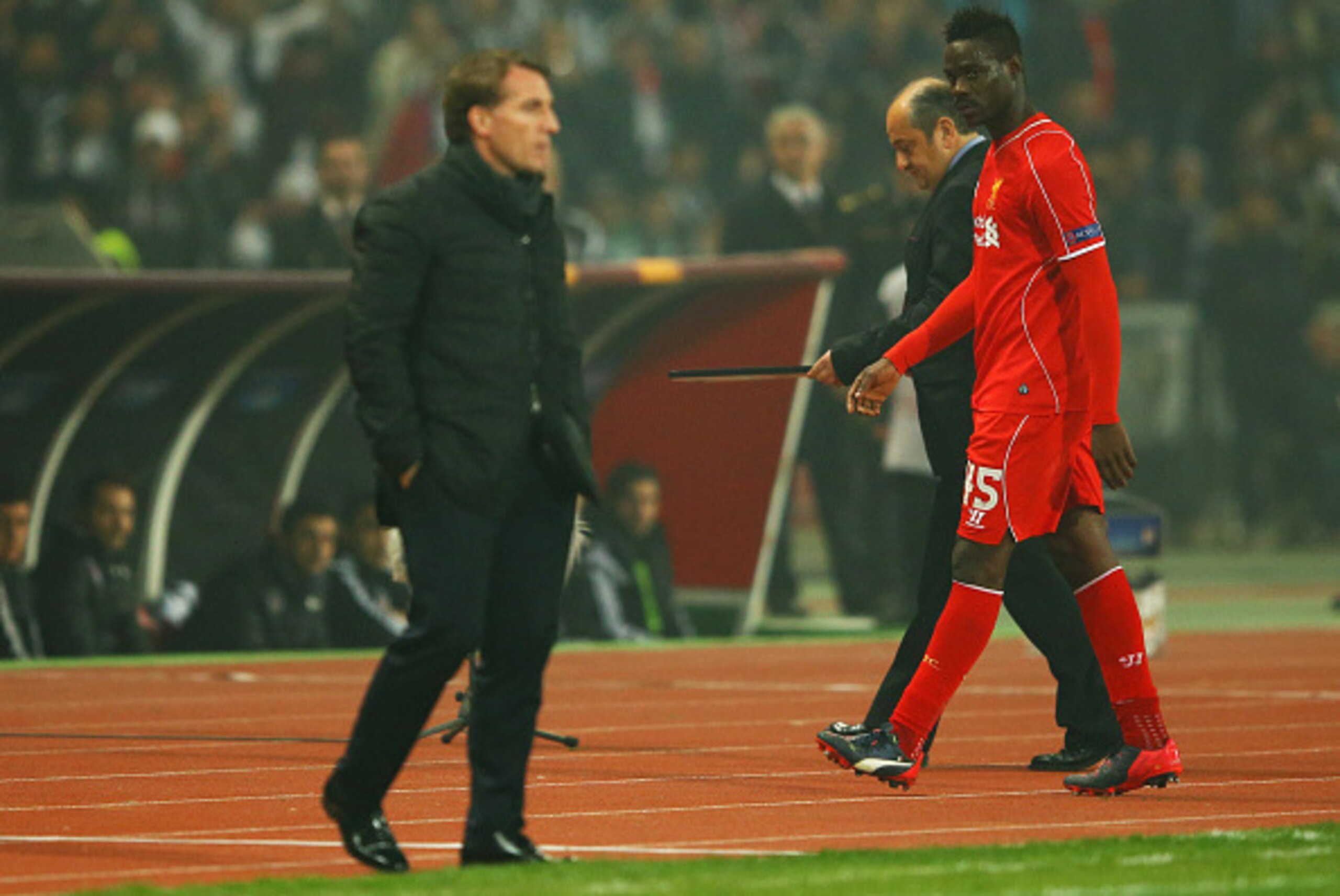 ISTANBUL, TURKEY - FEBRUARY 26:  Mario Balotelli of Liverpool looks across as Brendan Rodgers manager of Liverpool as he is substituted during the UEFA Europa League Round of 32 second leg match between Besiktas JK and Liverpool FC on February 26, 2015 in