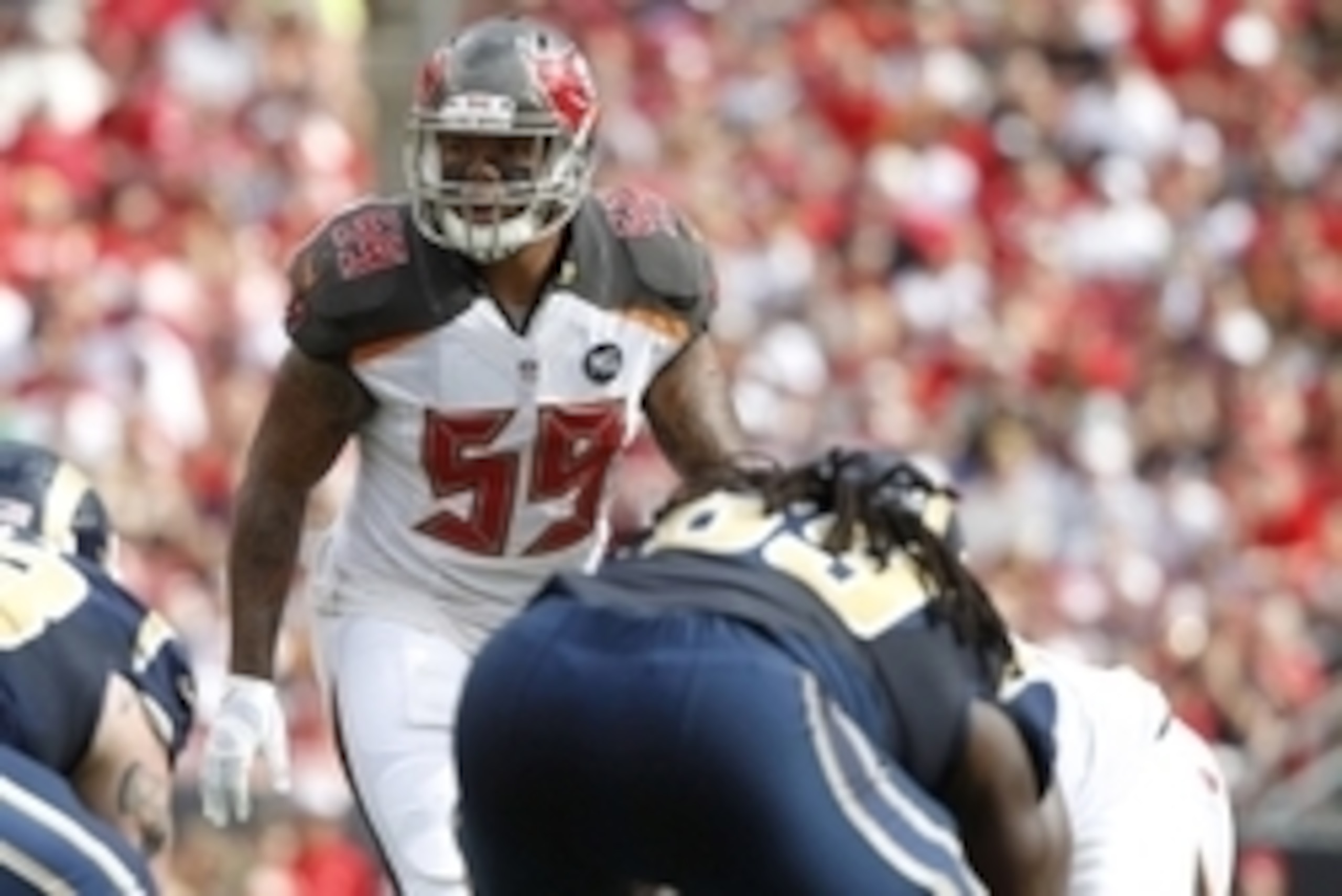 Sep 14, 2014; Tampa, FL, USA;Tampa Bay Buccaneers middle linebacker Mason Foster (59) rushes against the St. Louis Rams during the first half at Raymond James Stadium. Mandatory Credit: Kim Klement-USA TODAY Sports