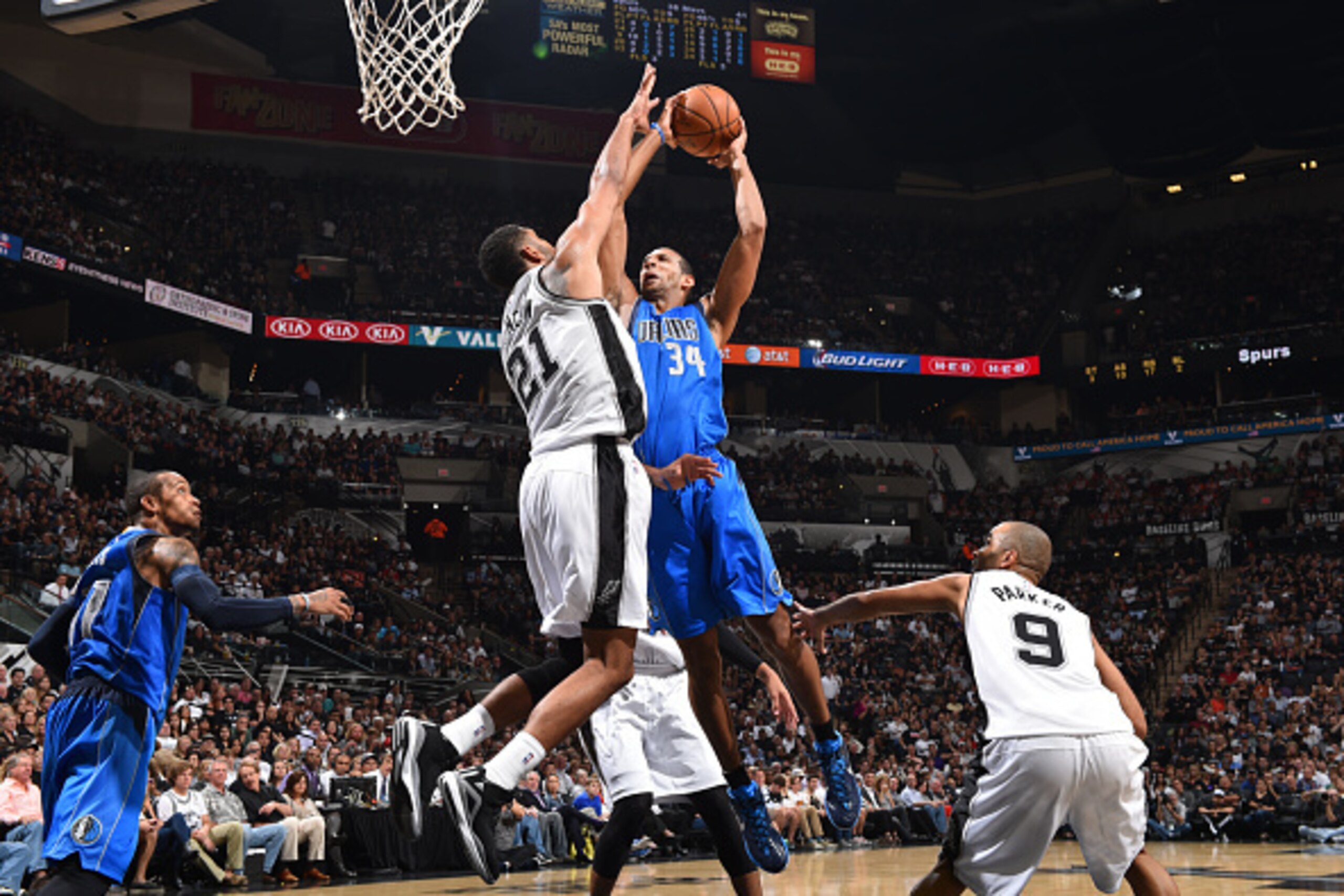 SAN ANTONIO, TX - OCTOBER 28: Tim Duncan #21 of the San Antonio Spurs defends the basket against Brandan Wright #34 of the Dallas Mavericks during the game on October 28, 2014 at the AT&T Center in San Antonio,Texas. NOTE TO USER: User expressly acknowled