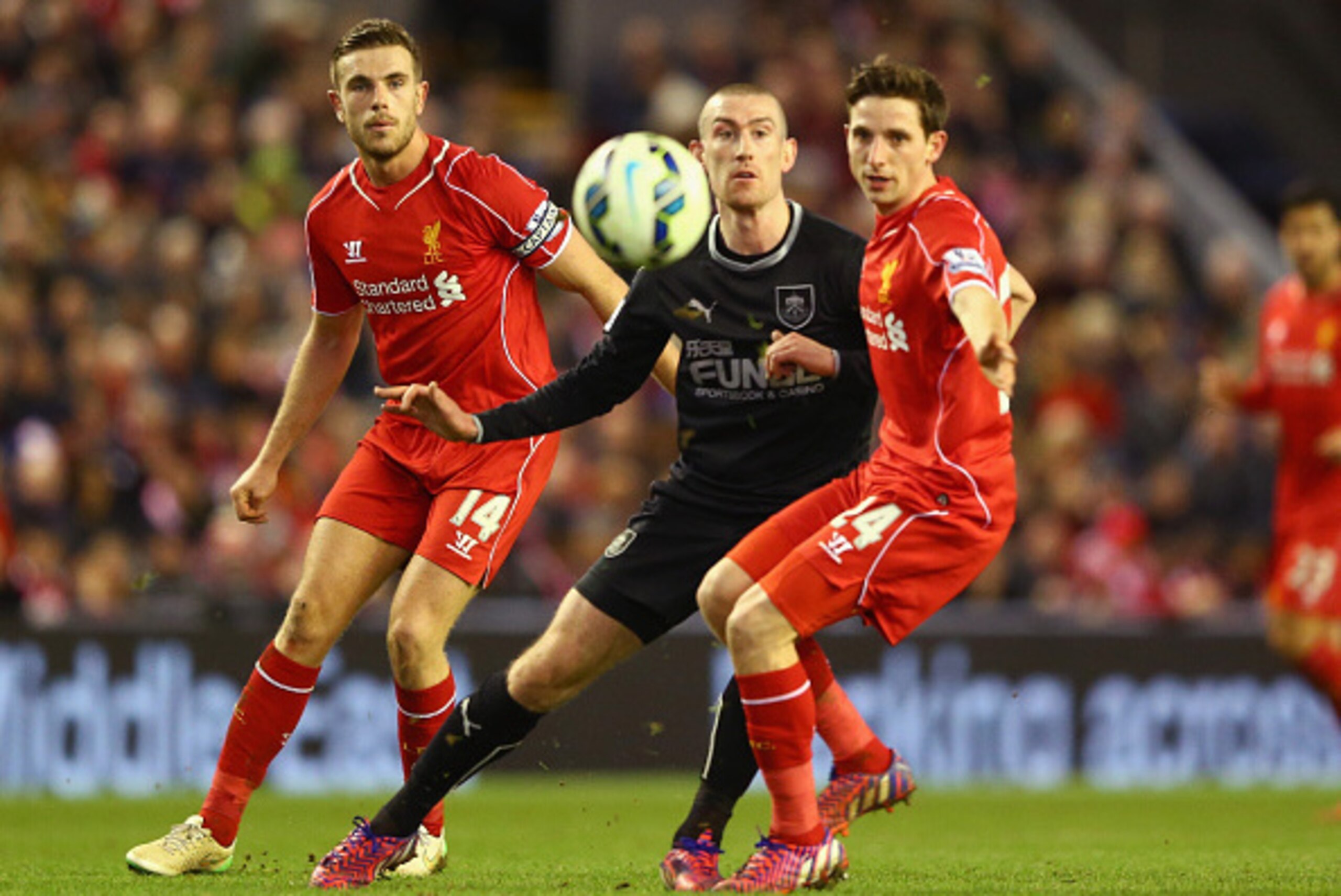 LIVERPOOL, ENGLAND - MARCH 04:  Jordan Henderson and Joe Allen of Liverpool close down David Jones of Burnley during the Barclays Premier League match between Liverpool and Burnley at Anfield on March 4, 2015 in Liverpool, England.  (Photo by Michael Stee