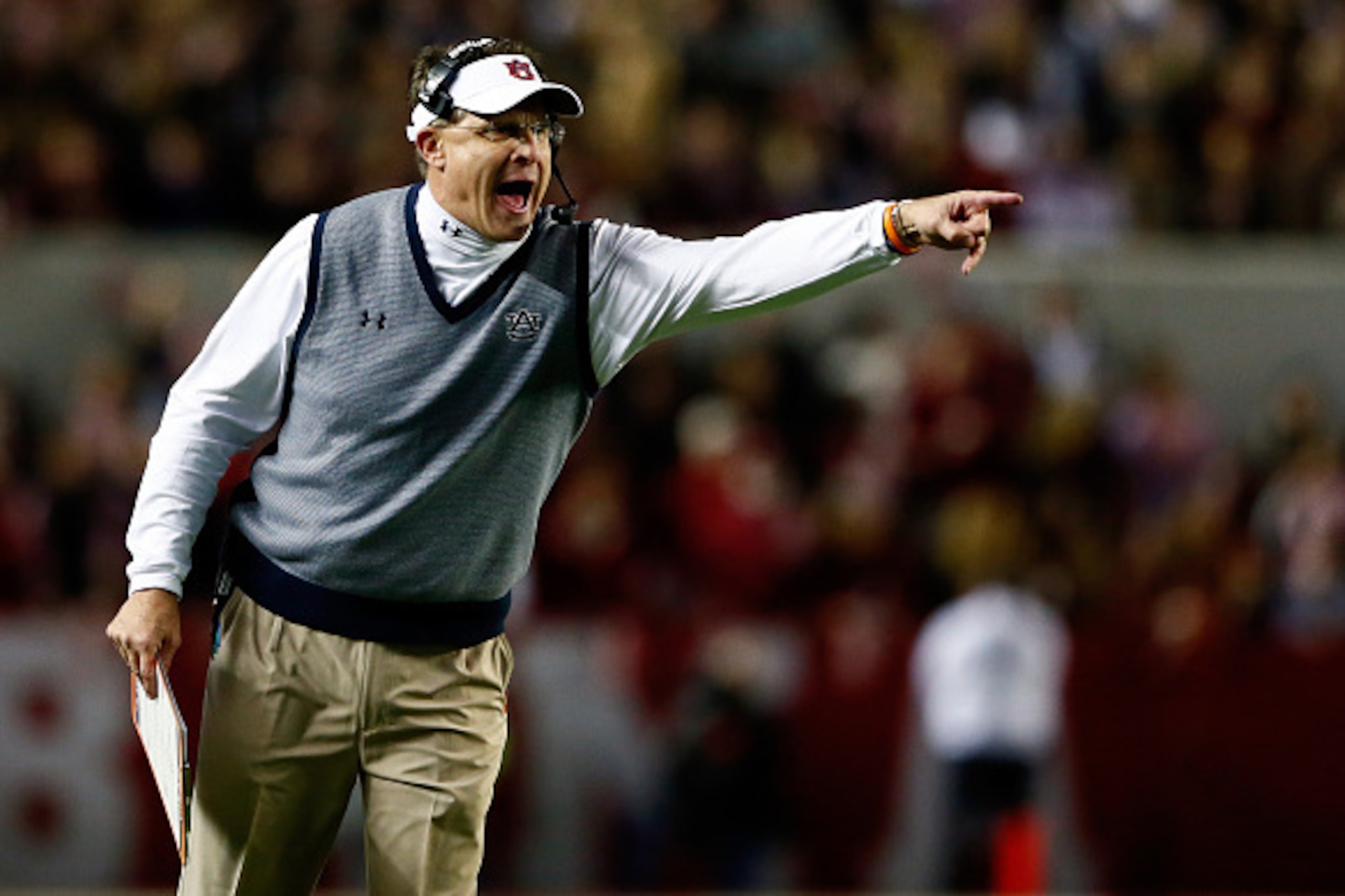 TUSCALOOSA, AL - NOVEMBER 29:  Head coach Gus Malzahn of the Auburn Tigers shouts in the first half during the Iron Bowl against the Alabama Crimson Tide at Bryant-Denny Stadium on November 29, 2014 in Tuscaloosa, Alabama.  (Photo by Kevin C. Cox/Getty Im
