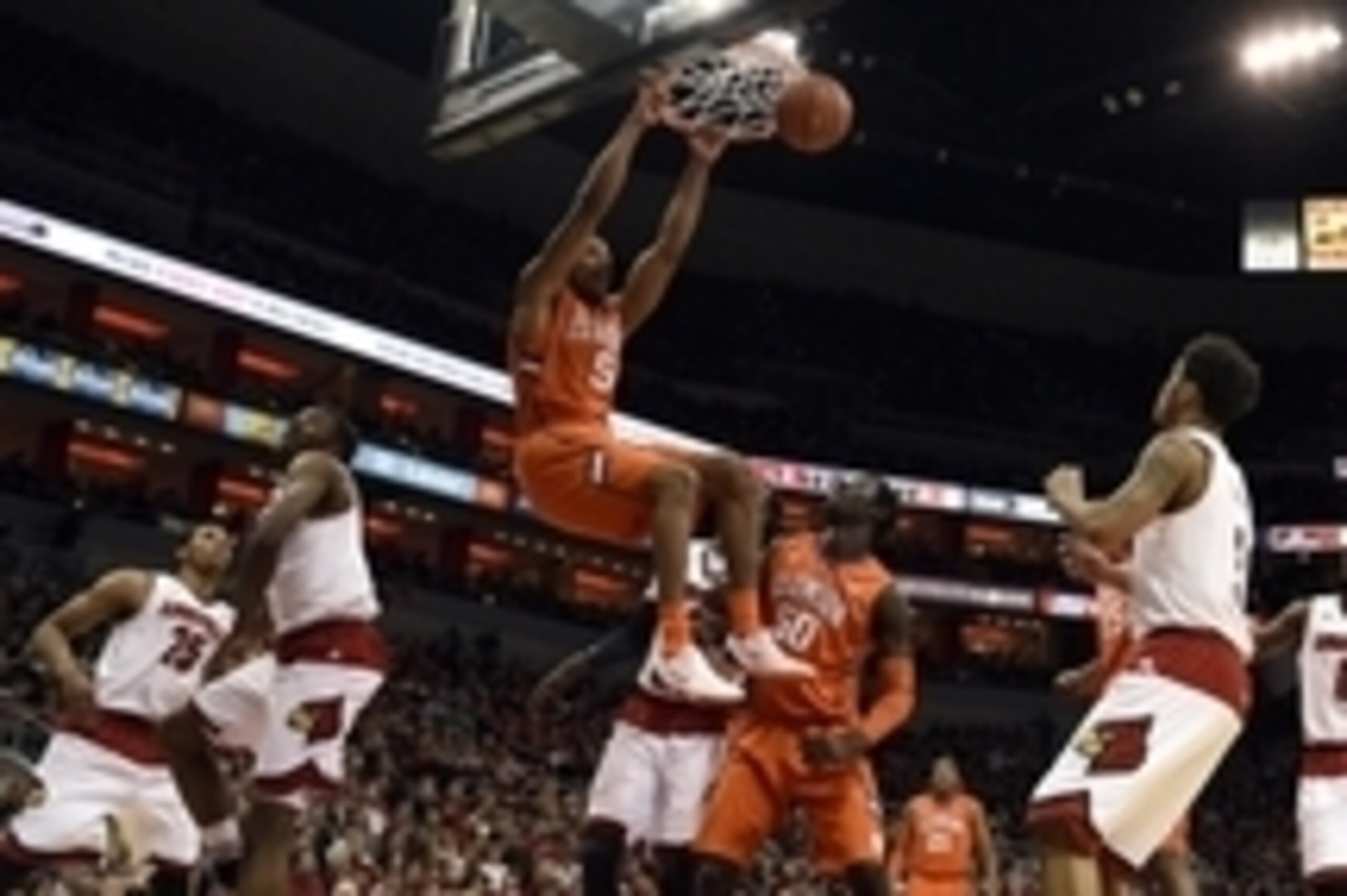 Jan 7, 2015; Louisville, KY, USA; Clemson Tigers forward Jaron Blossomgame (5) dunks against the Louisville Cardinals during the first half at KFC Yum! Center. Mandatory Credit: Jamie Rhodes-USA TODAY Sports