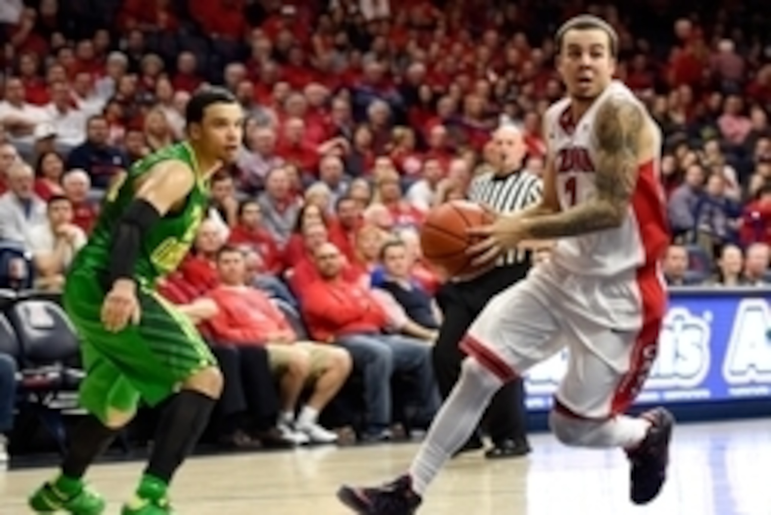 Jan 28, 2015; Tucson, AZ, USA; Arizona Wildcats guard Gabe York (1) drives to the basket past Oregon Ducks forward Dillon Brooks (24) during the second half at McKale Center. Arizona won 90-56. Mandatory Credit: Casey Sapio-USA TODAY Sports
